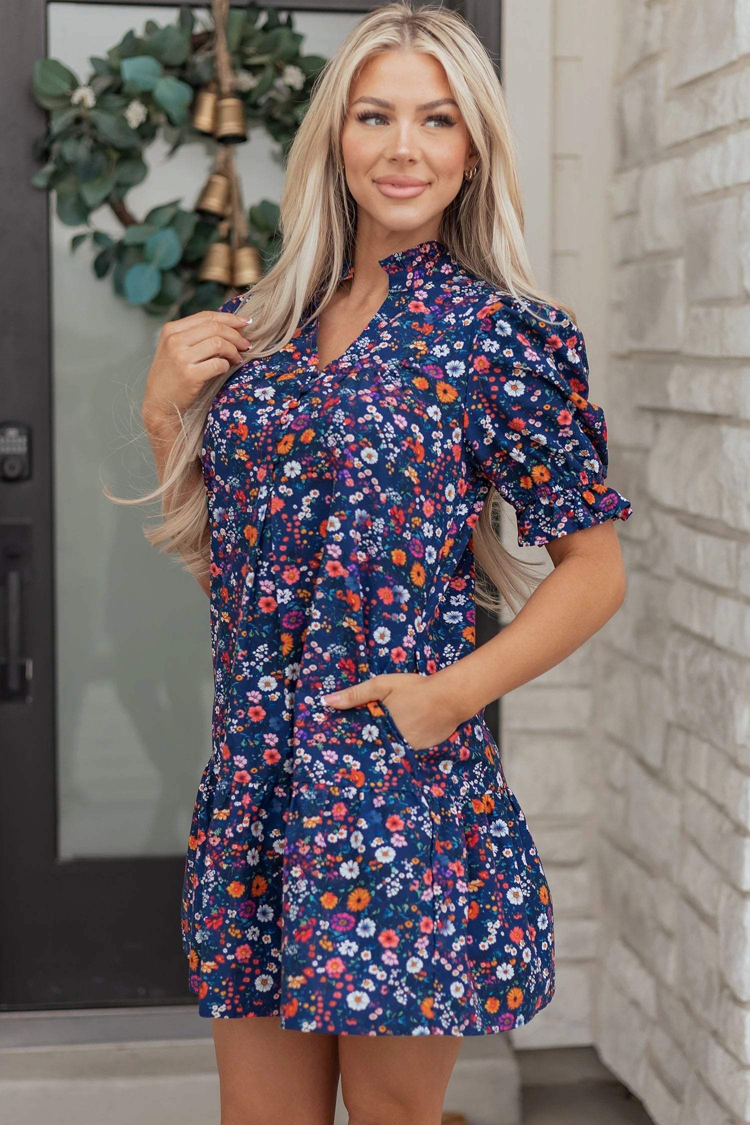 Navy mini dress with wild daisy floral print and puff sleeves