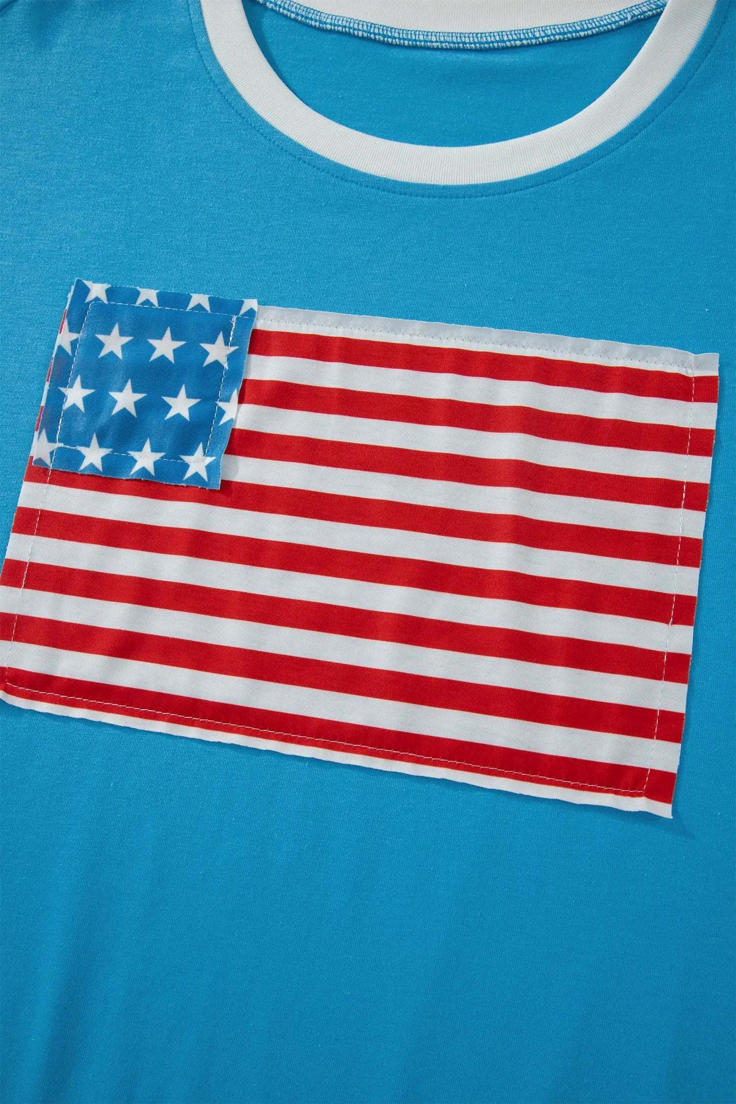 Woman wearing a patchwork US flag t-shirt with colorblock sleeves and starry chest panel