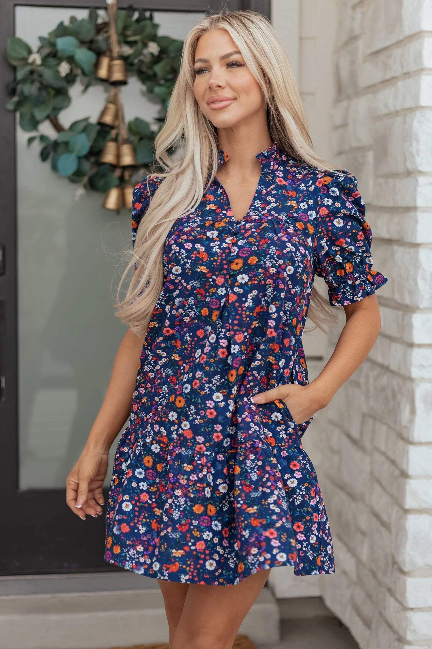 Navy mini dress with wild daisy floral print and puff sleeves