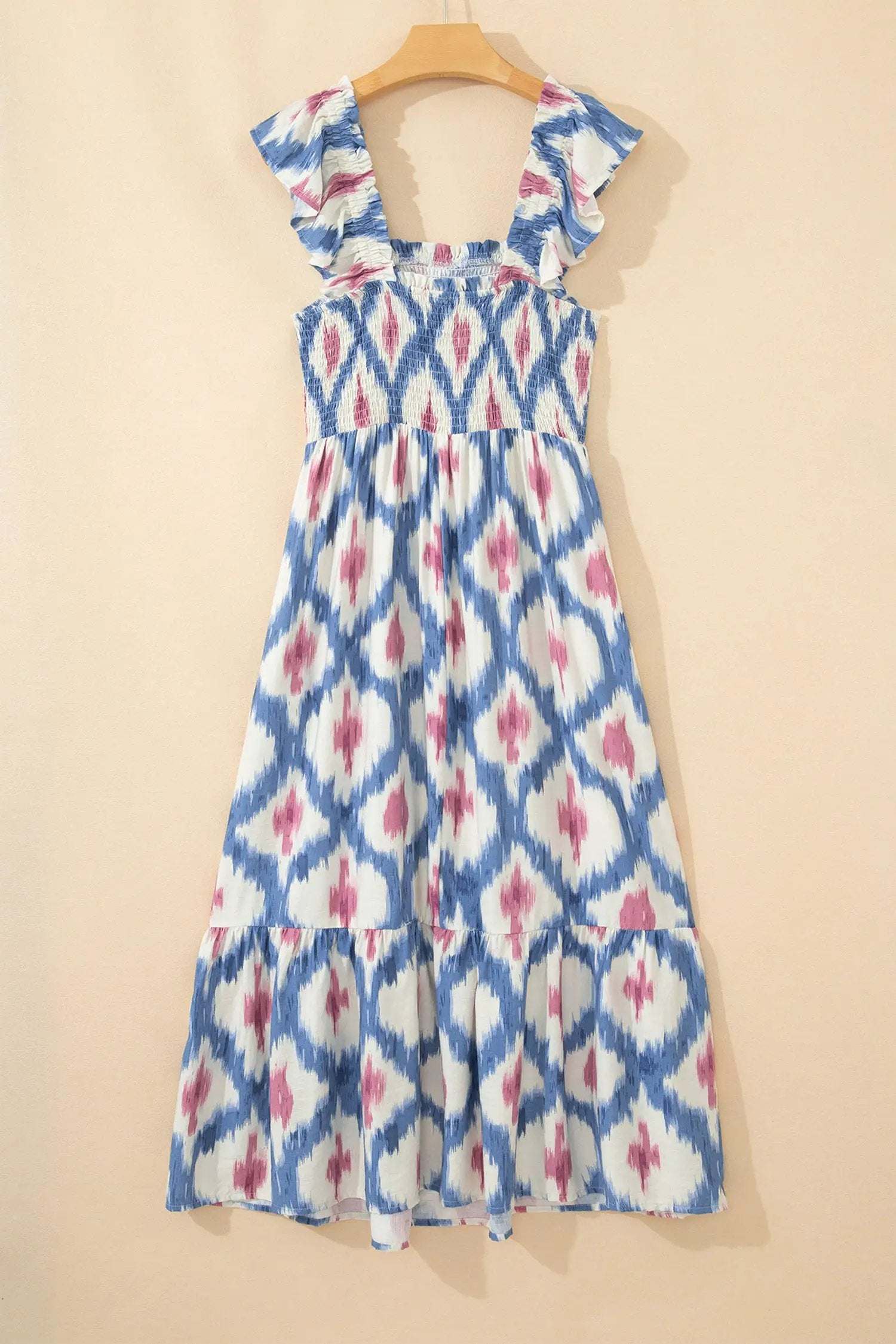 Woman wearing Boho Vacation Vibes geometric print square neck smocked high waist A-line dress with ruffle sleeves