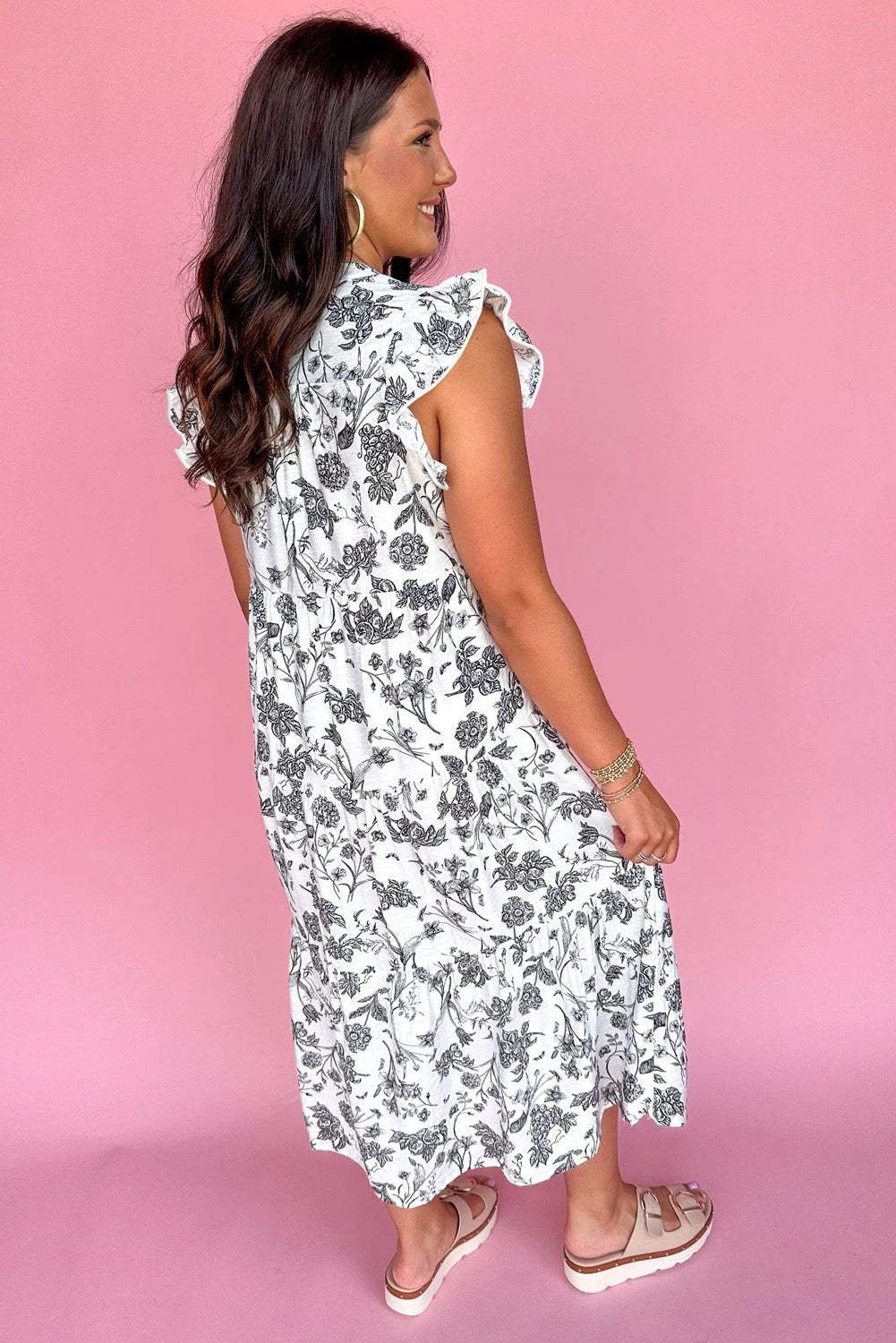 Plus size floral maxi dress with notched neck, piping trim, and ruffle sleeves
