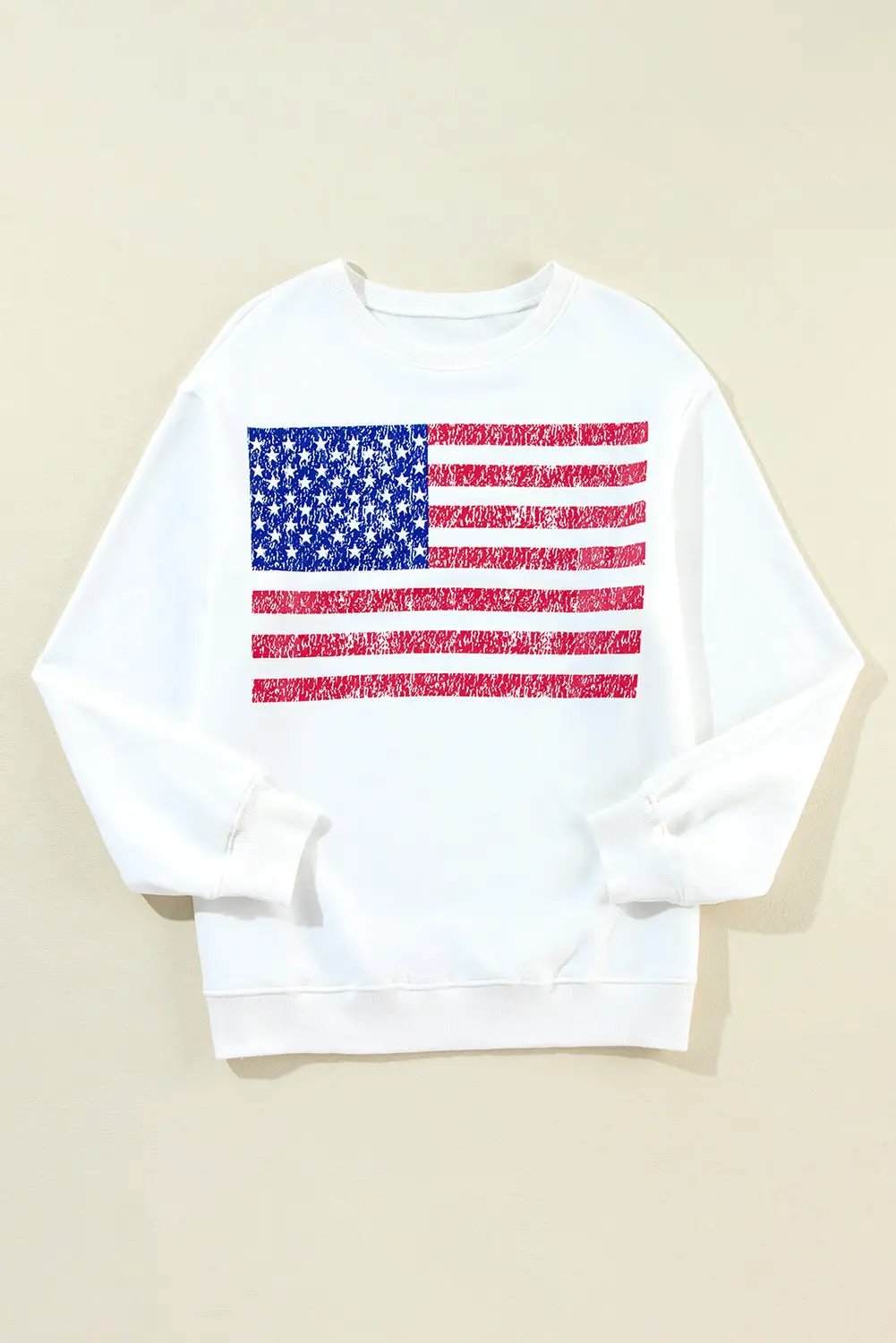 White oversized sweatshirt with distressed American flag graphic and drop-shoulder design