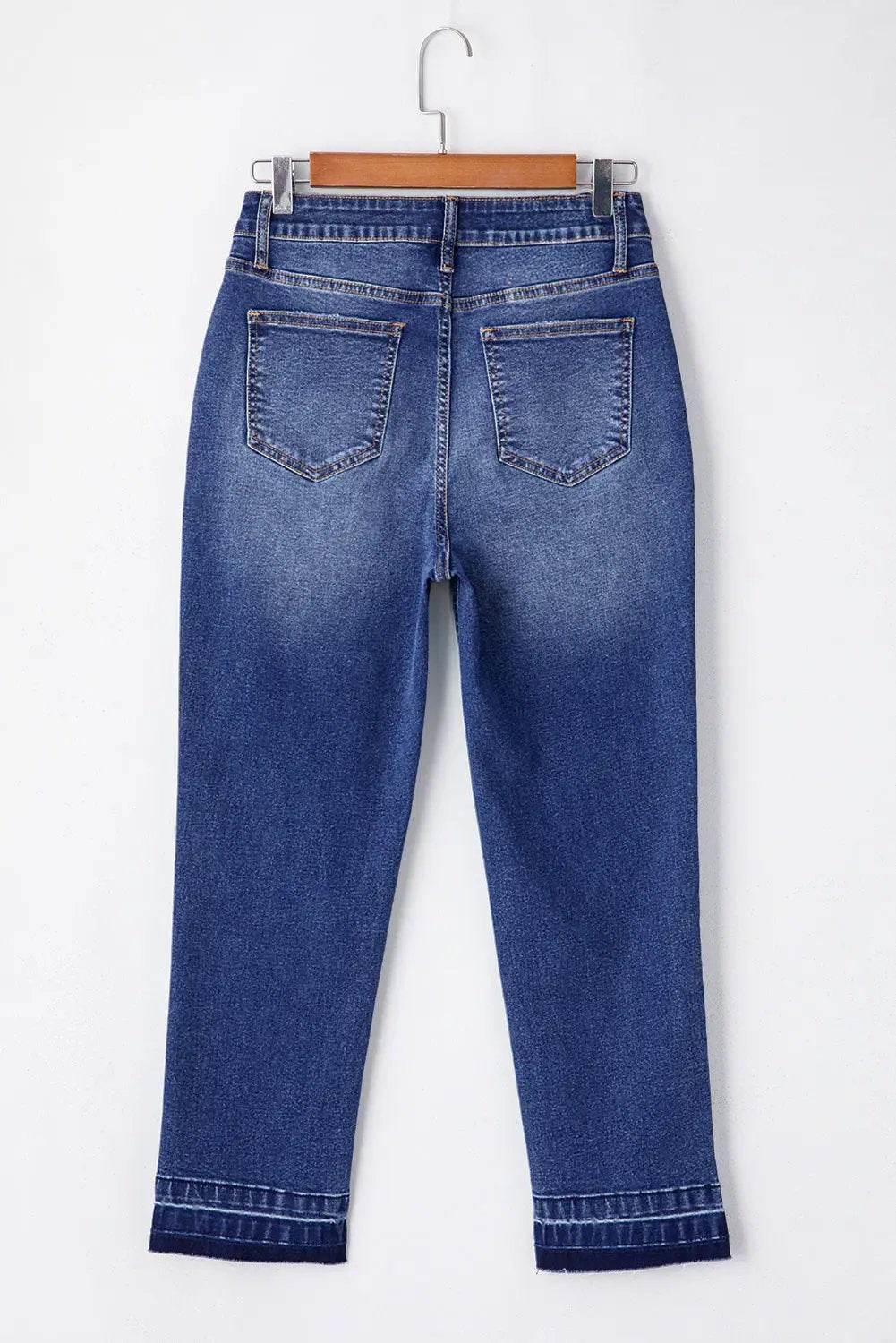 Whiskered wash cropped jeans with raw hem showcasing main character energy style