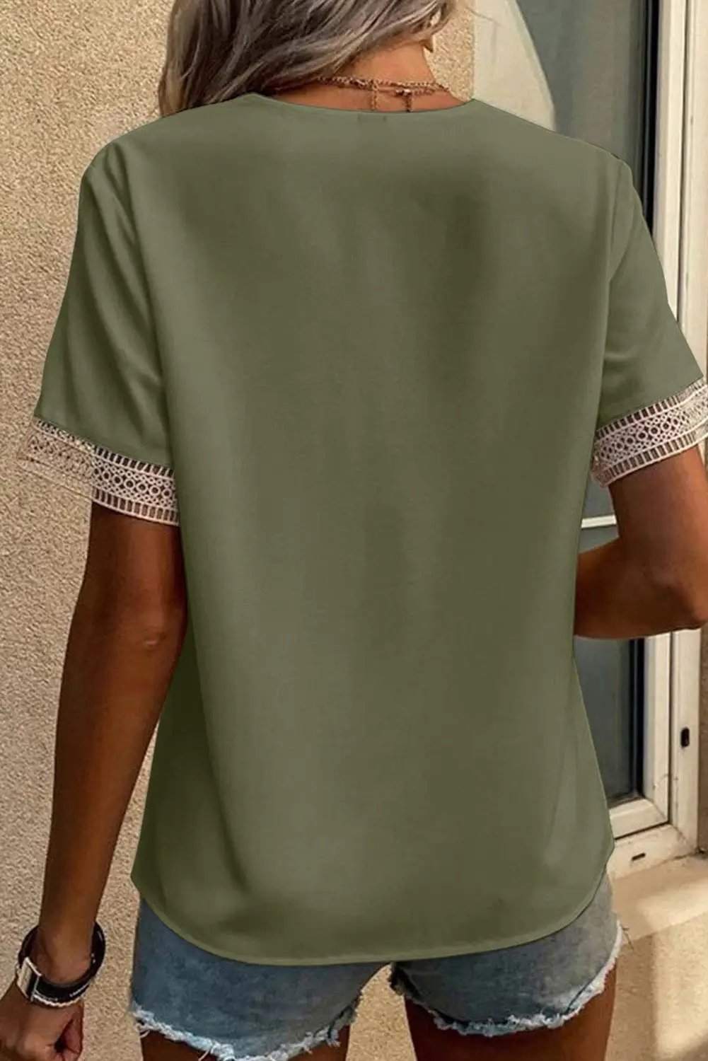 Boho chic lace trim V-neck blouse with short sleeves and relaxed fit