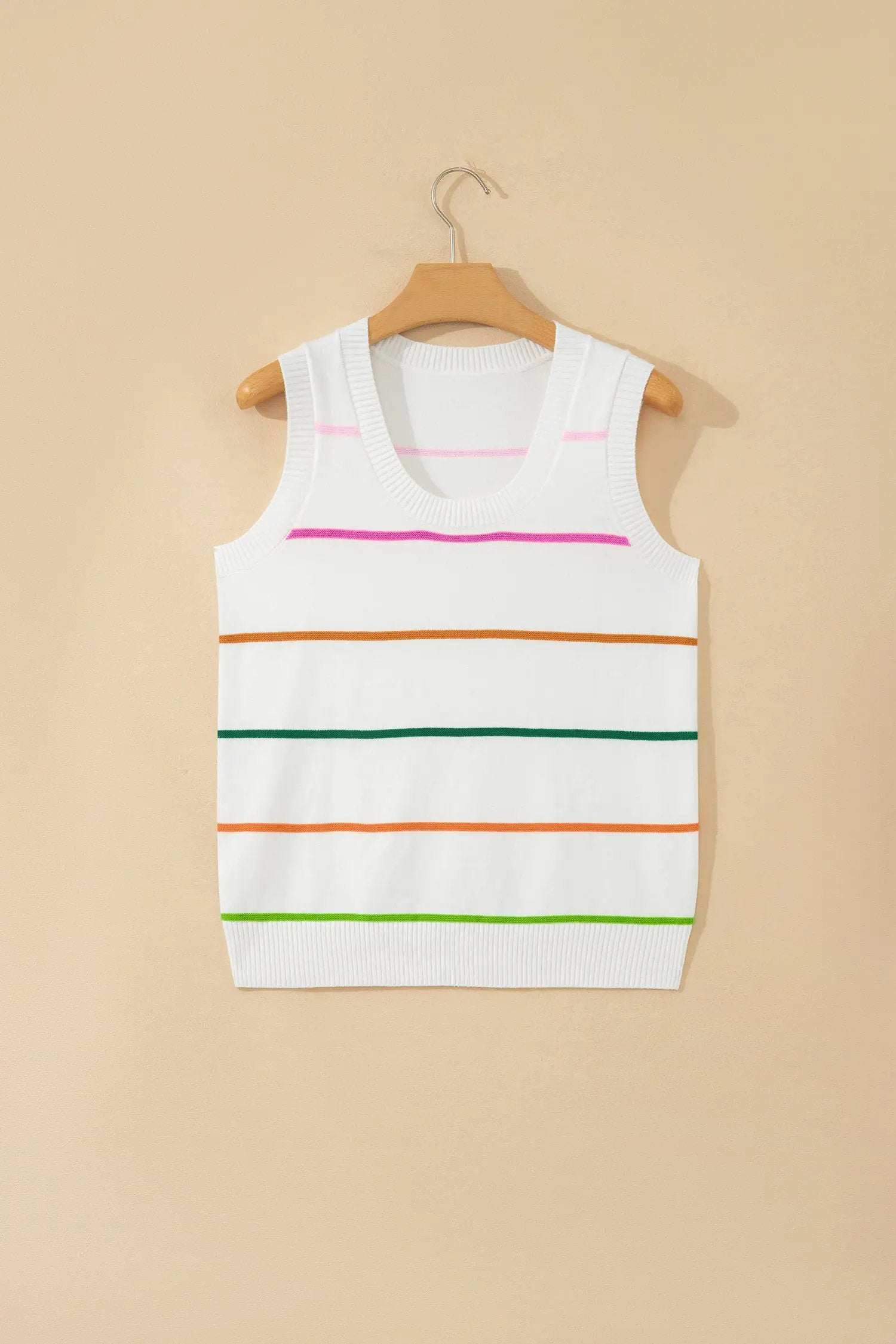 Woman wearing a cozy stripe round-neck knit sleeveless tank top with color-block accents