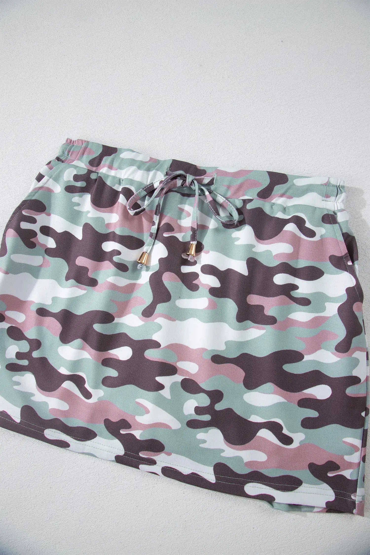 Green camouflage print drawstring mini skort with elastic waist and pastel tones for everyday casual wear
