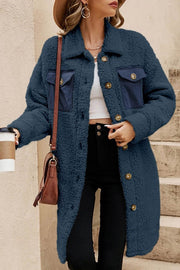 Single-breasted teddy fleece coat with plush texture and navy contrast flap pockets