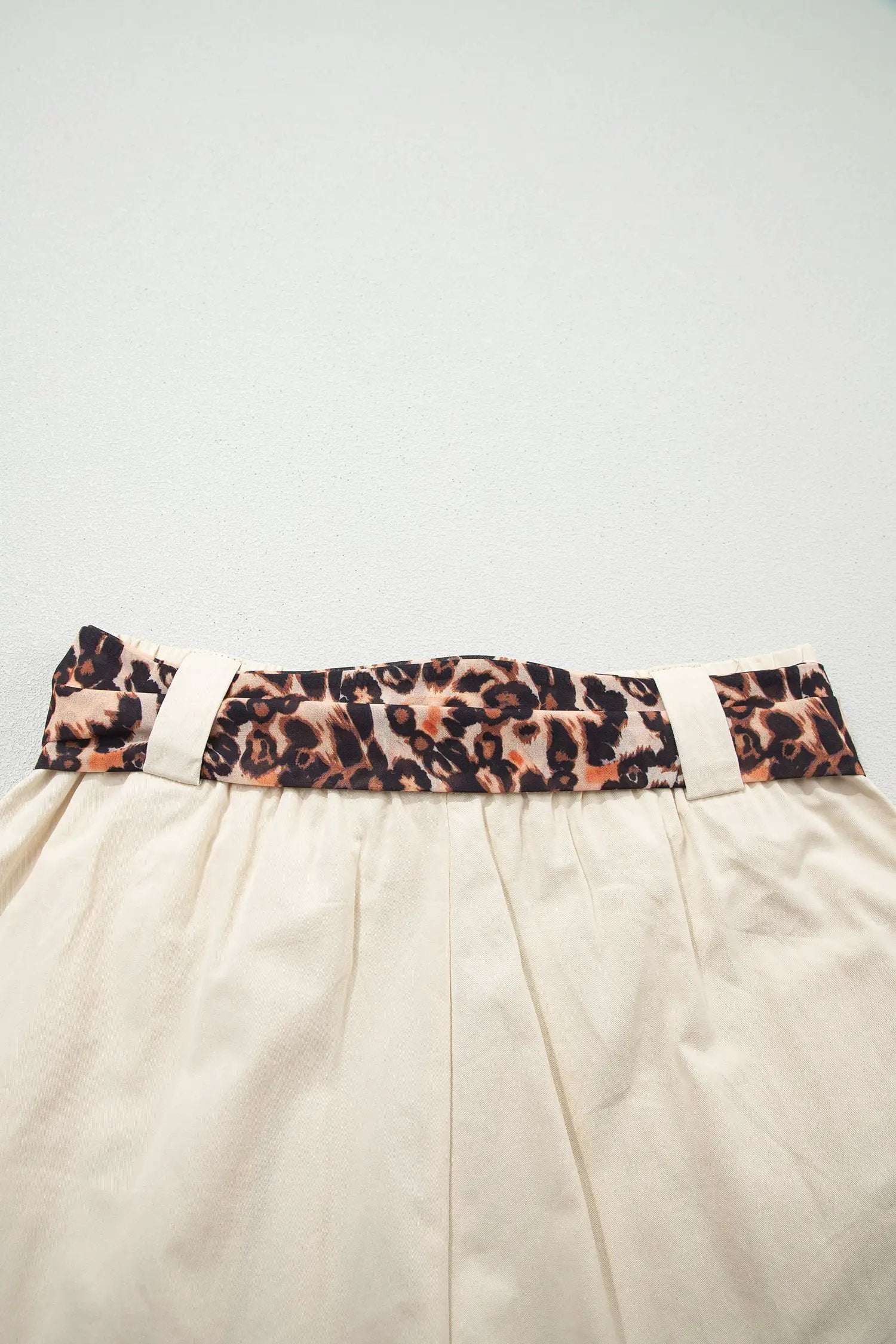 Pink pleated wide leg shorts with leopard contrast sash belt for weekend vibe style