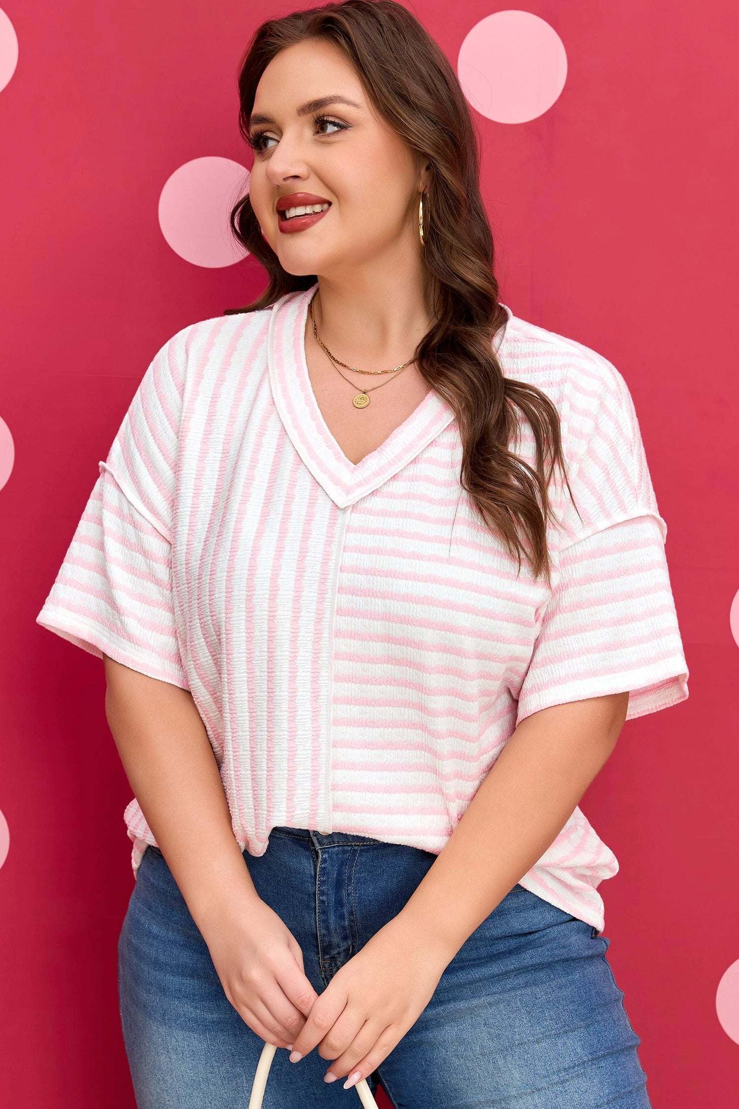 Plus size pink stripe V-neck tee with exposed seam detailing by J&H Apparel