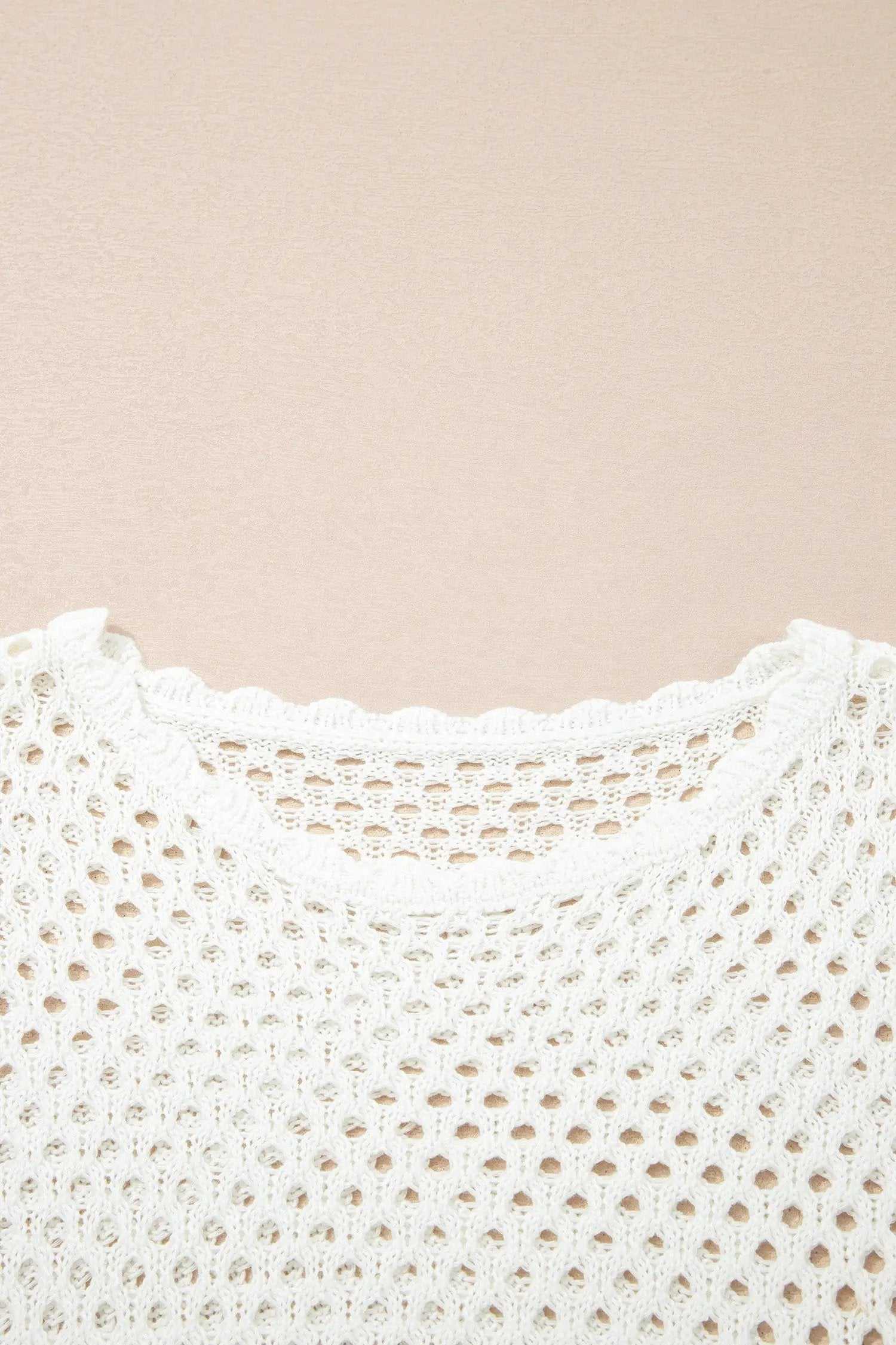 Hollow Out Knit Top with scalloped trim and long sleeves