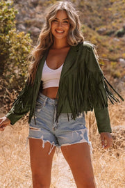 Woman wearing cropped fringe faux suede jacket with western detailing showcasing main character energy