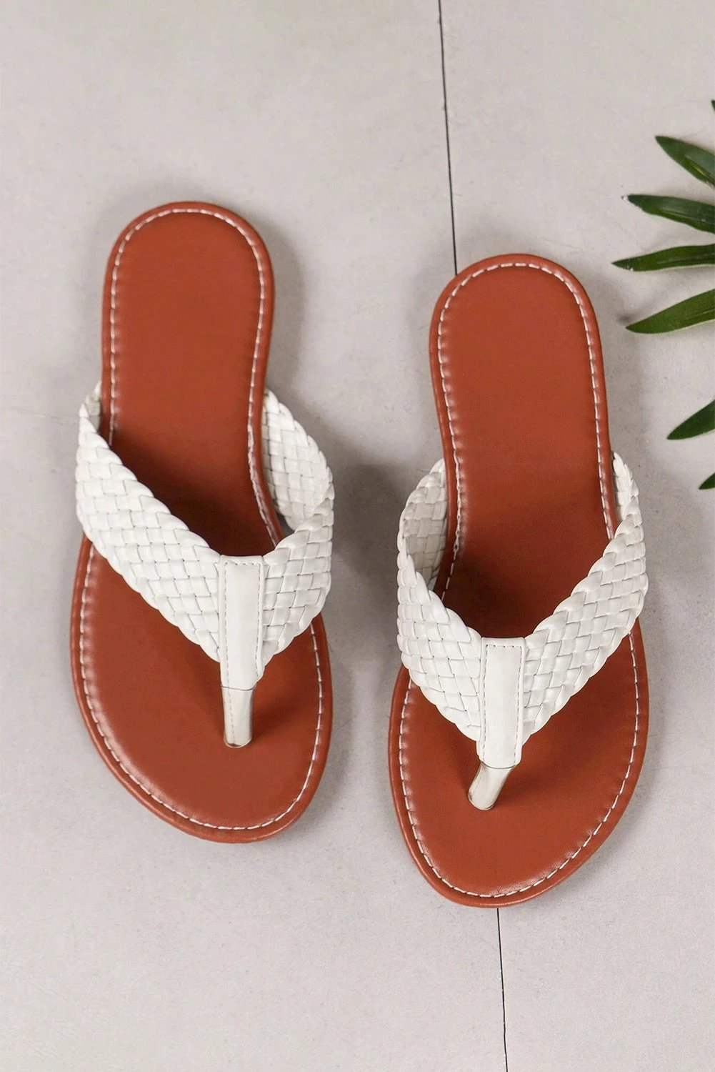 White braided strap PU leather flip flop with flat cushioned sole for comfortable summer wear