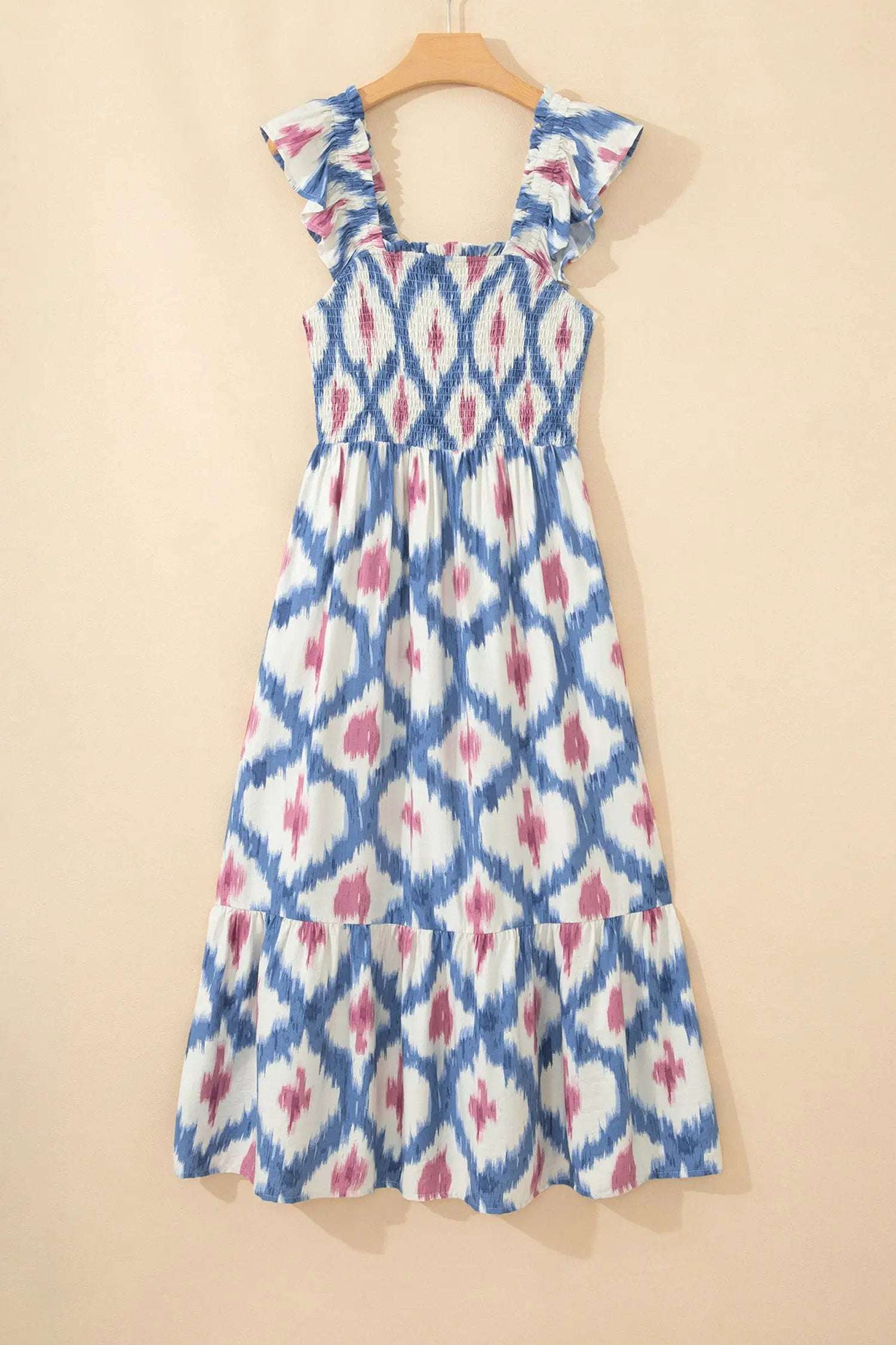 Woman wearing Boho Vacation Vibes geometric print square neck smocked waist A-line dress with ruffle sleeves