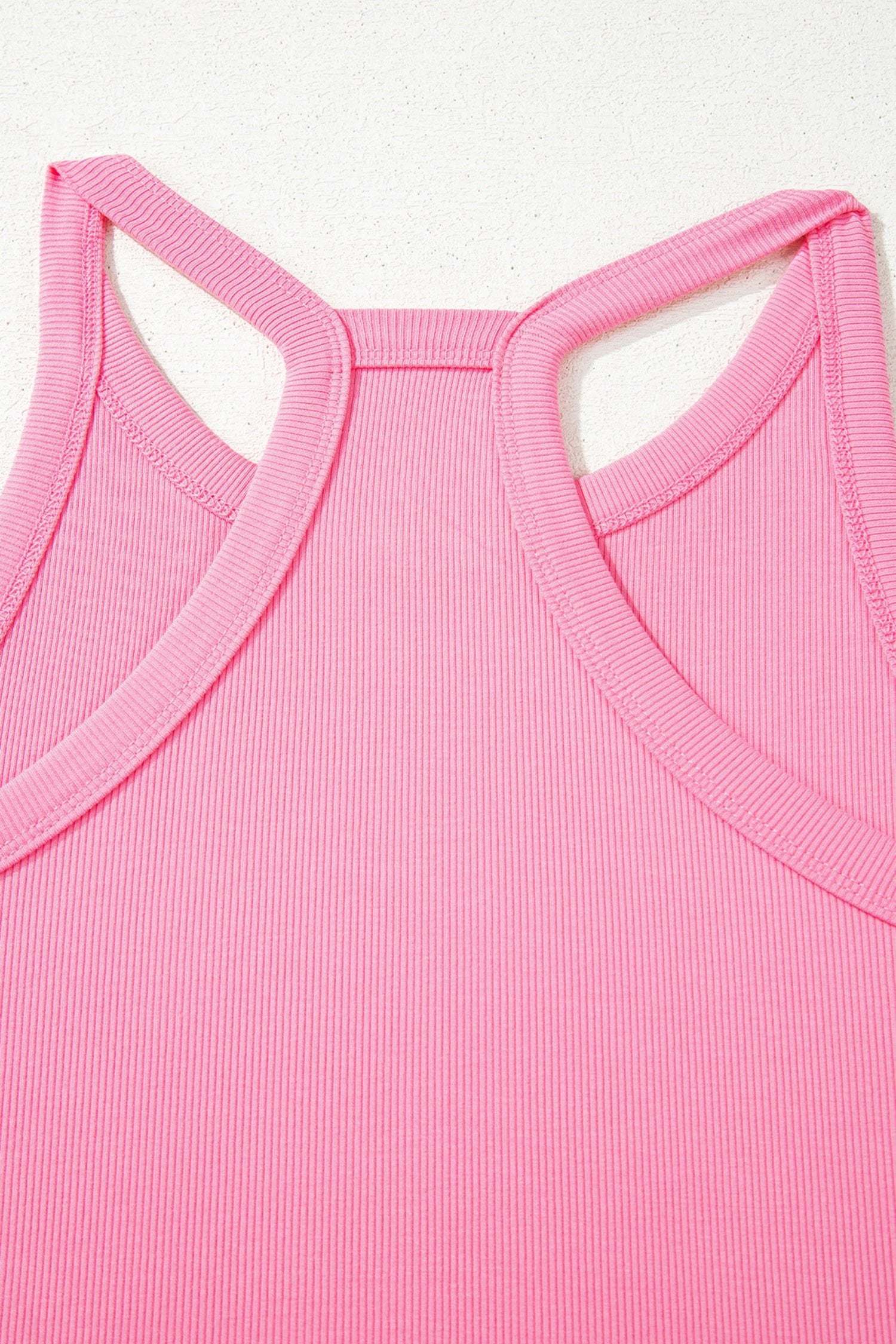 Woman wearing pink slim ribbed tank top and relaxed wide-leg sweatpants mom energy outfit