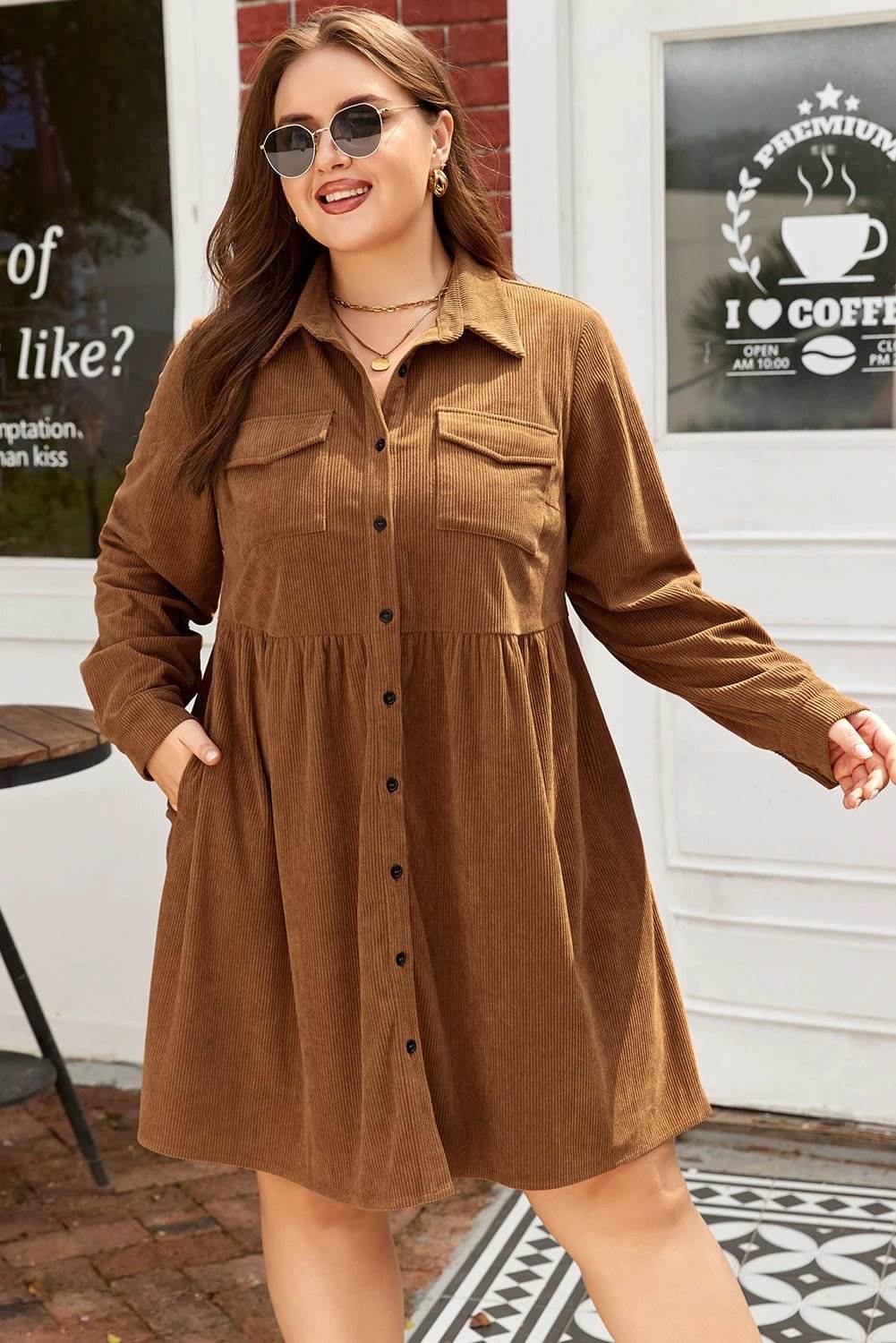 Plus size brown corduroy button-front shirt dress with collared neckline and A-line silhouette