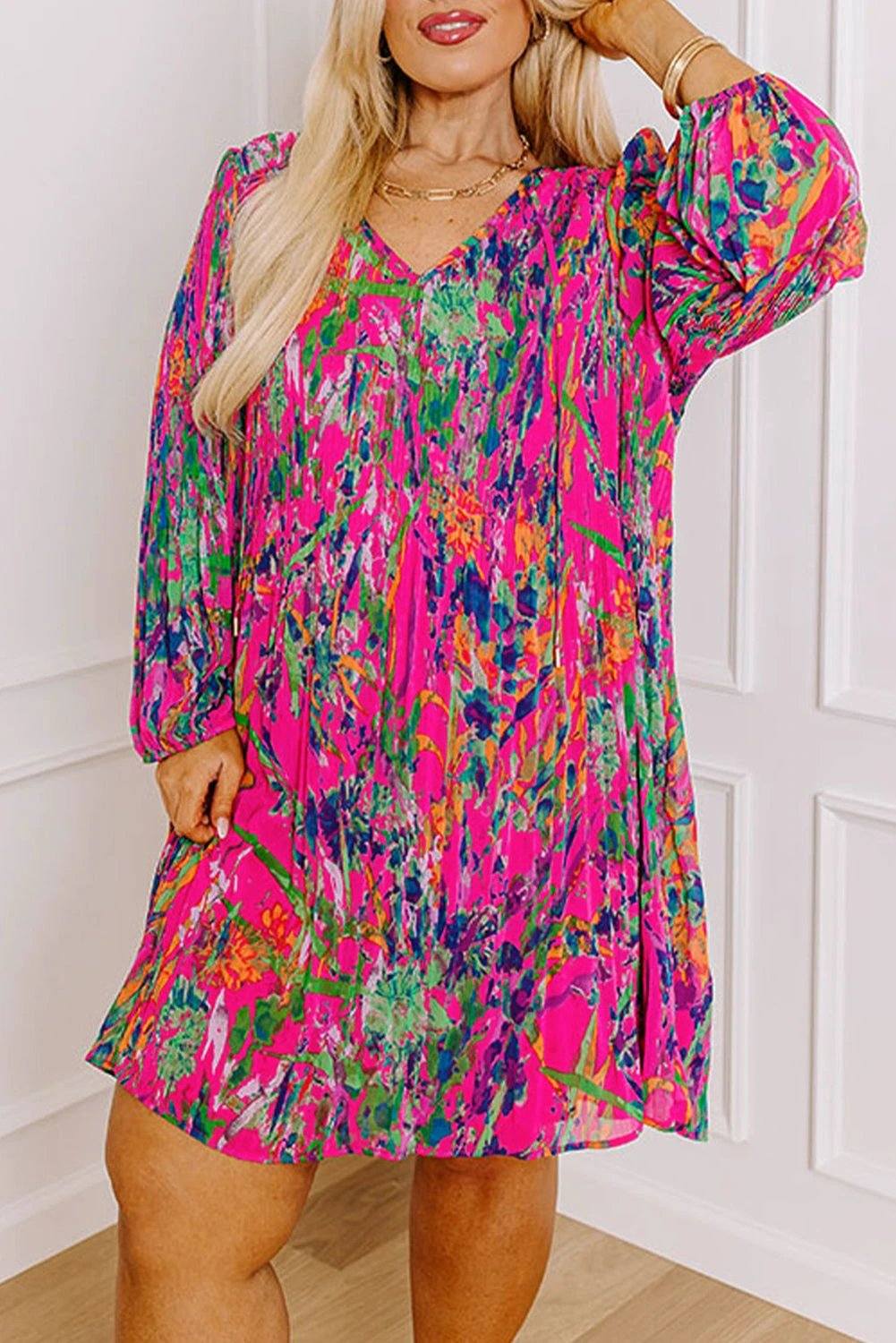 Plus size abstract floral print pleated dress with relaxed fit and vibrant colors