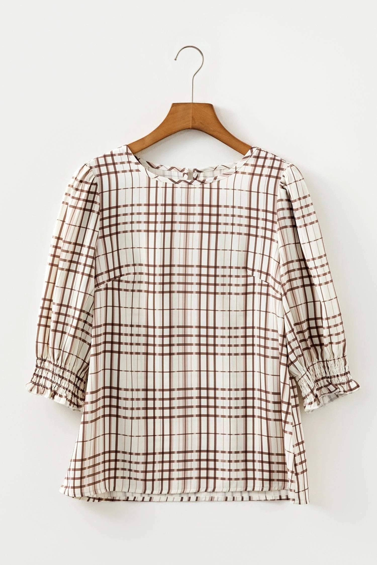 Woman wearing effortless mom chic plaid frilled puffy half sleeve blouse