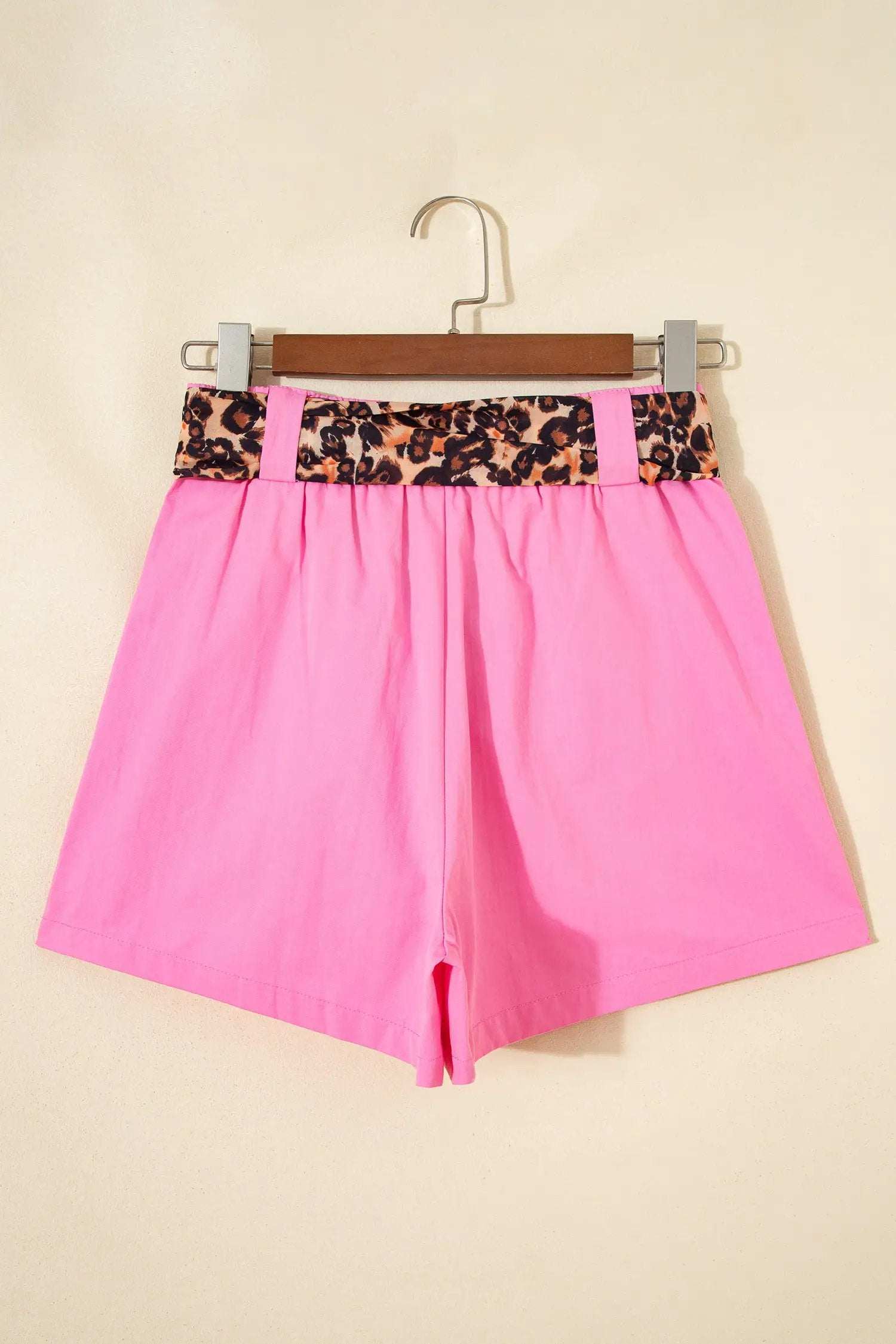 Pink pleated wide-leg shorts with leopard contrast sash belt for weekend vibe style