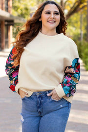 Plus size white floral patchwork sleeve textured pullover top with cream body and relaxed fit