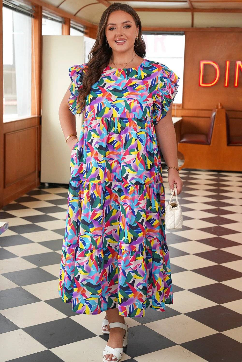 Plus size geometric print tiered maxi dress with ruffled short sleeves and Main Character Energy vibe