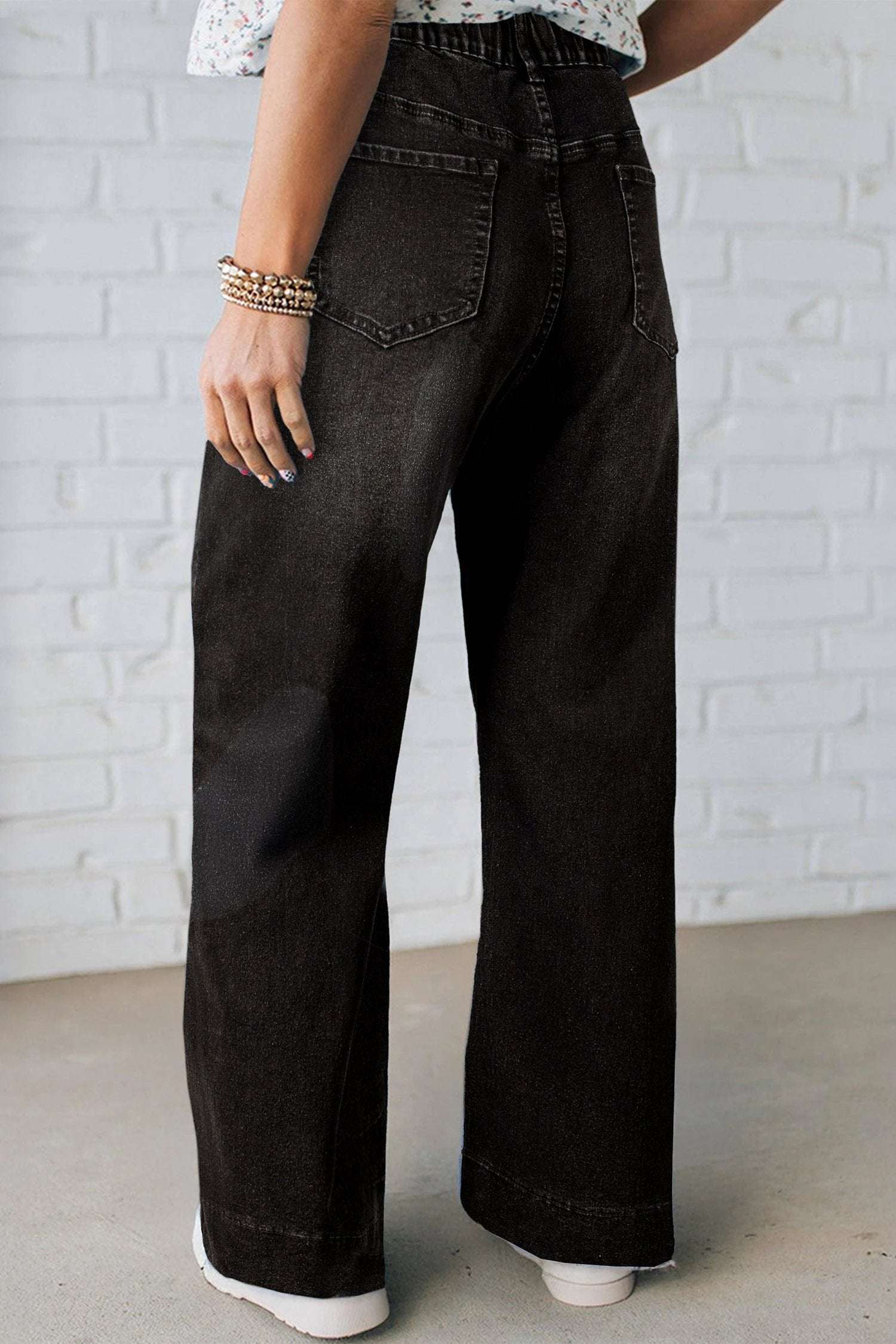 Plus size acid wash lace-up high rise wide leg jeans showcasing Main Character Energy style