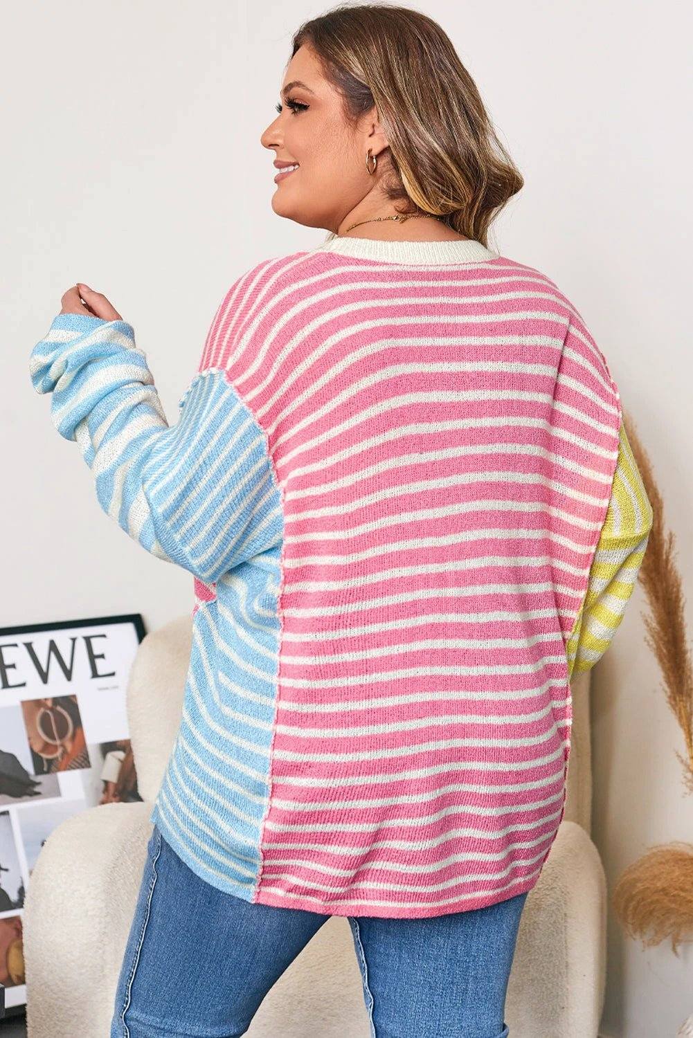 Plus size striped colorblock sweater with exposed seam detail and relaxed fit