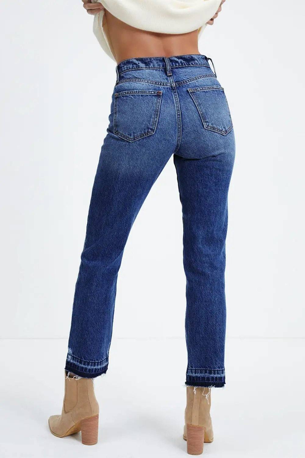 Whiskered wash cropped jeans with raw hem showcasing main character energy style