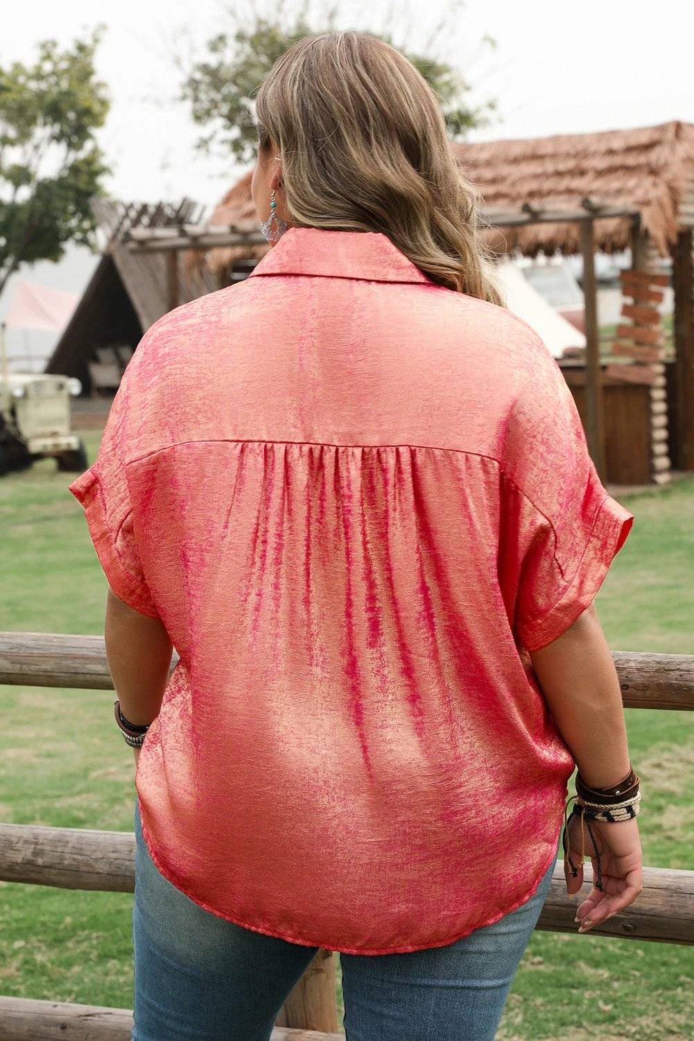 Plus size pink metallic sheen short sleeve satin button up shirt on mannequin