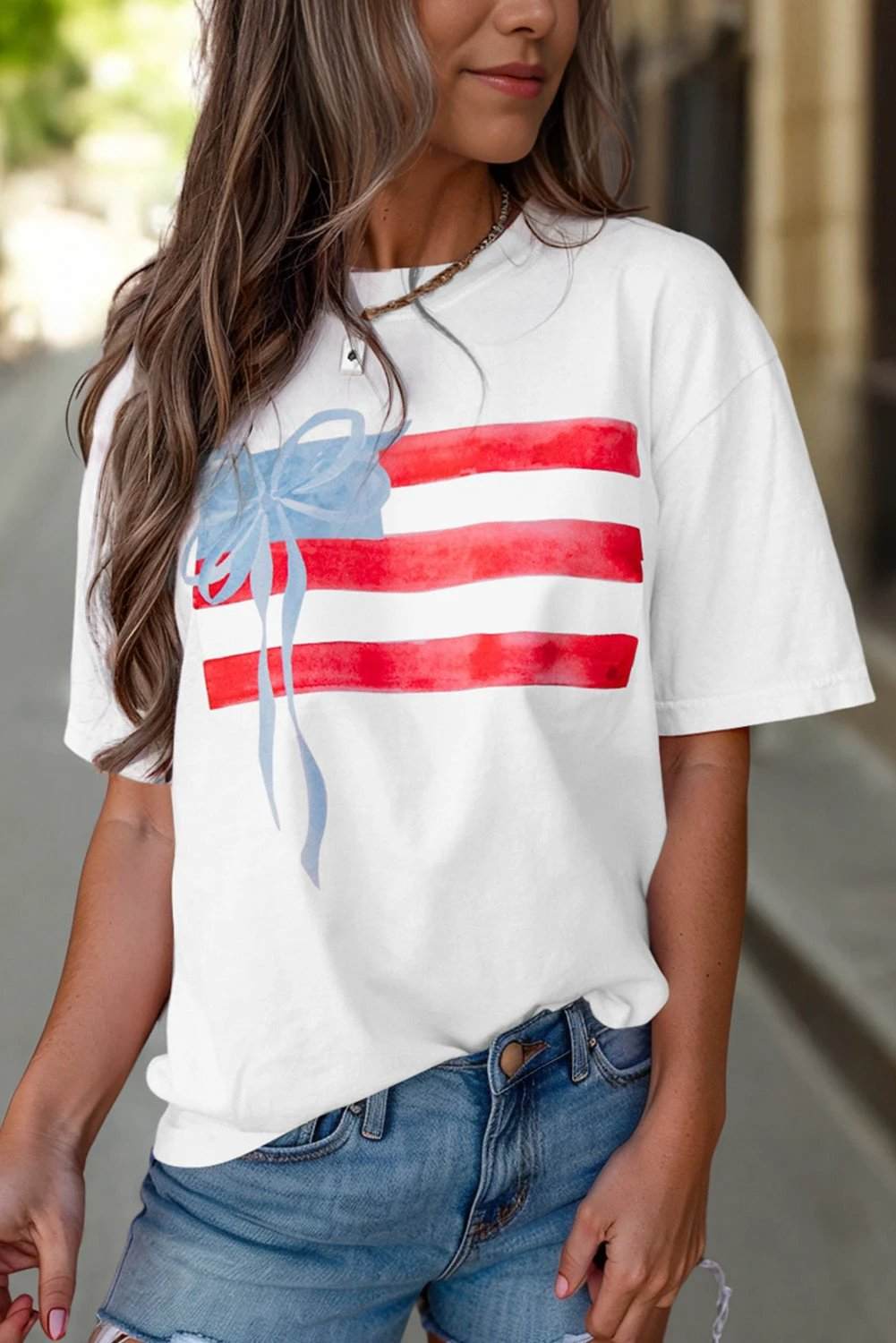 White crewneck tee with Patriotic Passion flag bow graphic and red stripes