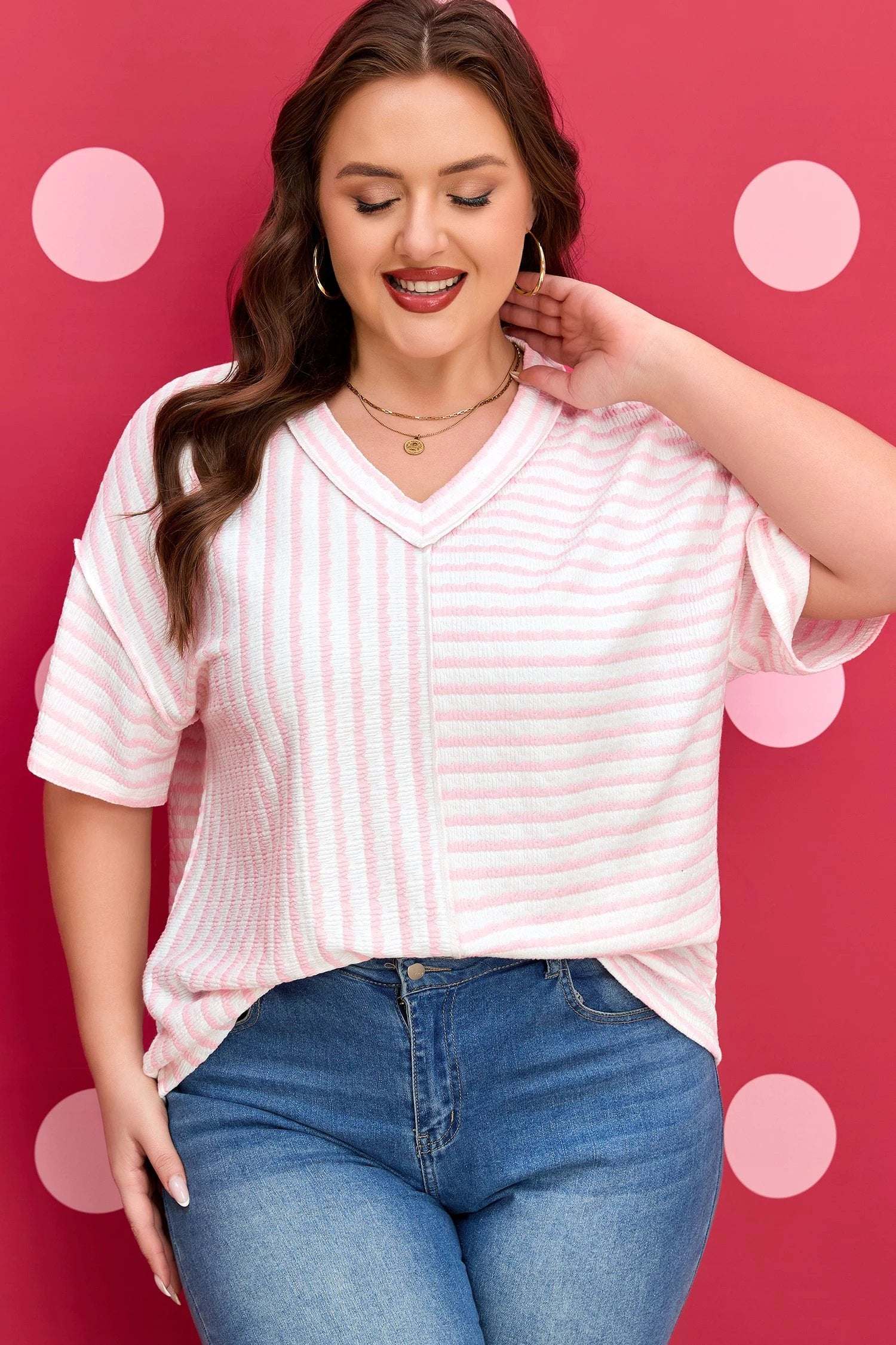 Plus Size Pink Stripe V-Neck Tee with exposed seam detailing and relaxed fit