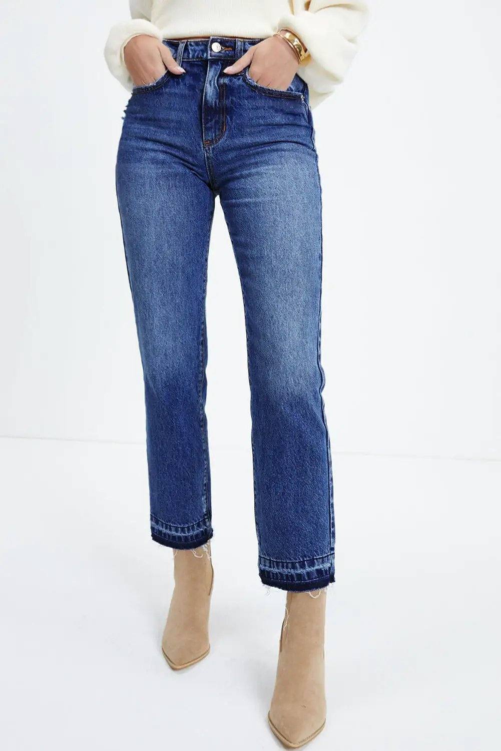 Whiskered wash cropped jeans with raw hem showcasing main character energy style