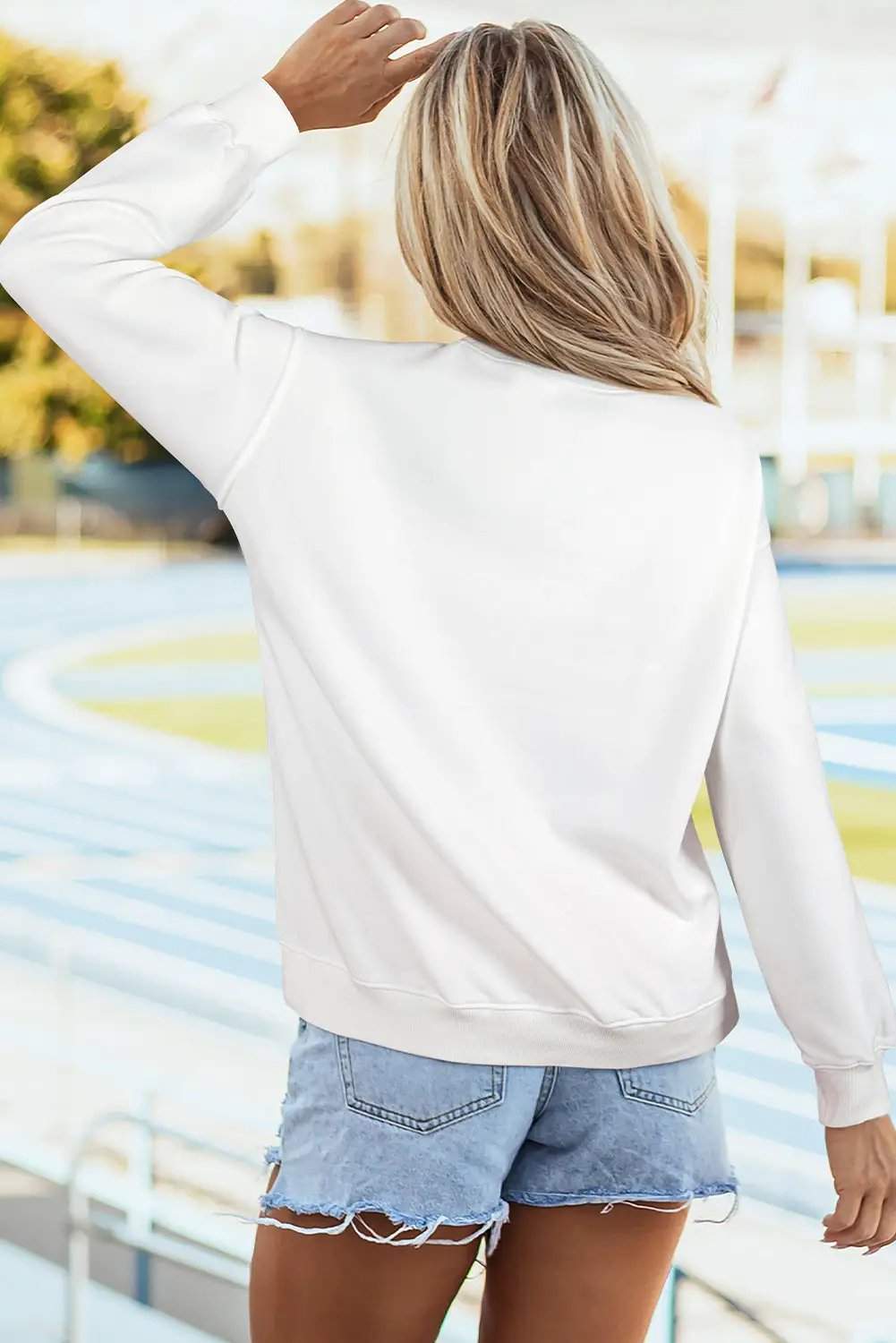 Oversized American flag graphic sweatshirt with drop-shoulder design on white fleece fabric