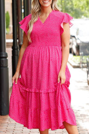 Plus size polka dot midi dress with smocked high waist and ruffled flutter sleeves