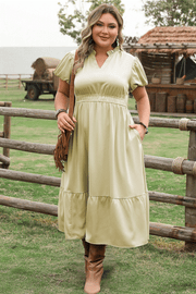 Plus size notched v-neck maxi dress with puff sleeves and tiered skirt in satin fabric