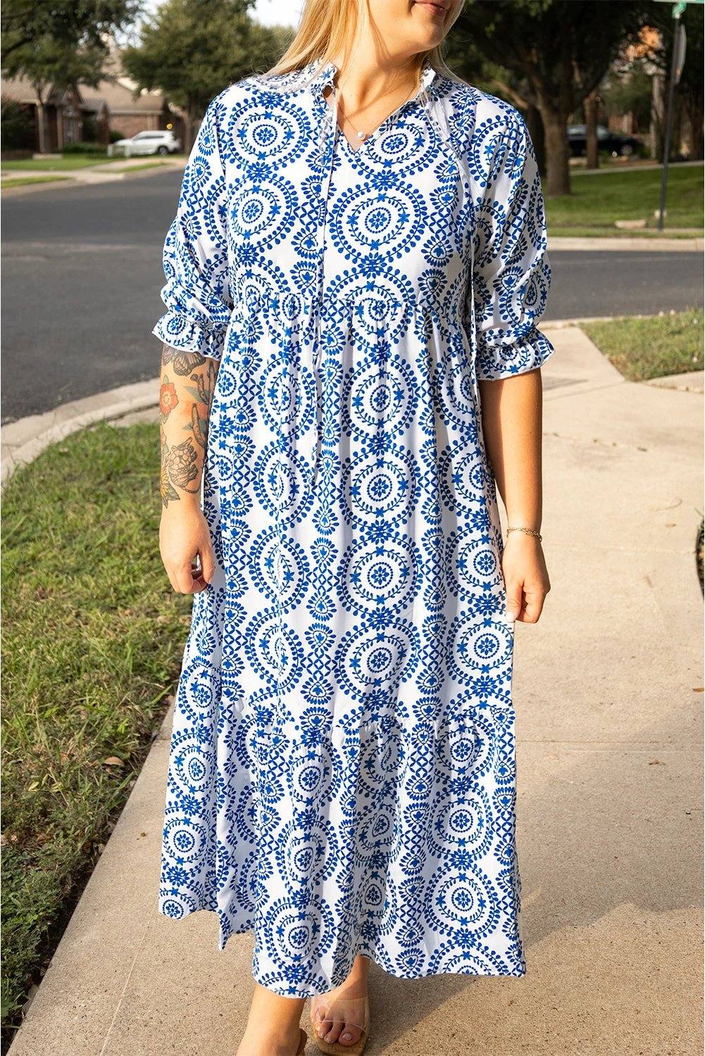 Plus size geometric print maxi dress with lace-up notch neck in blue and white pattern.