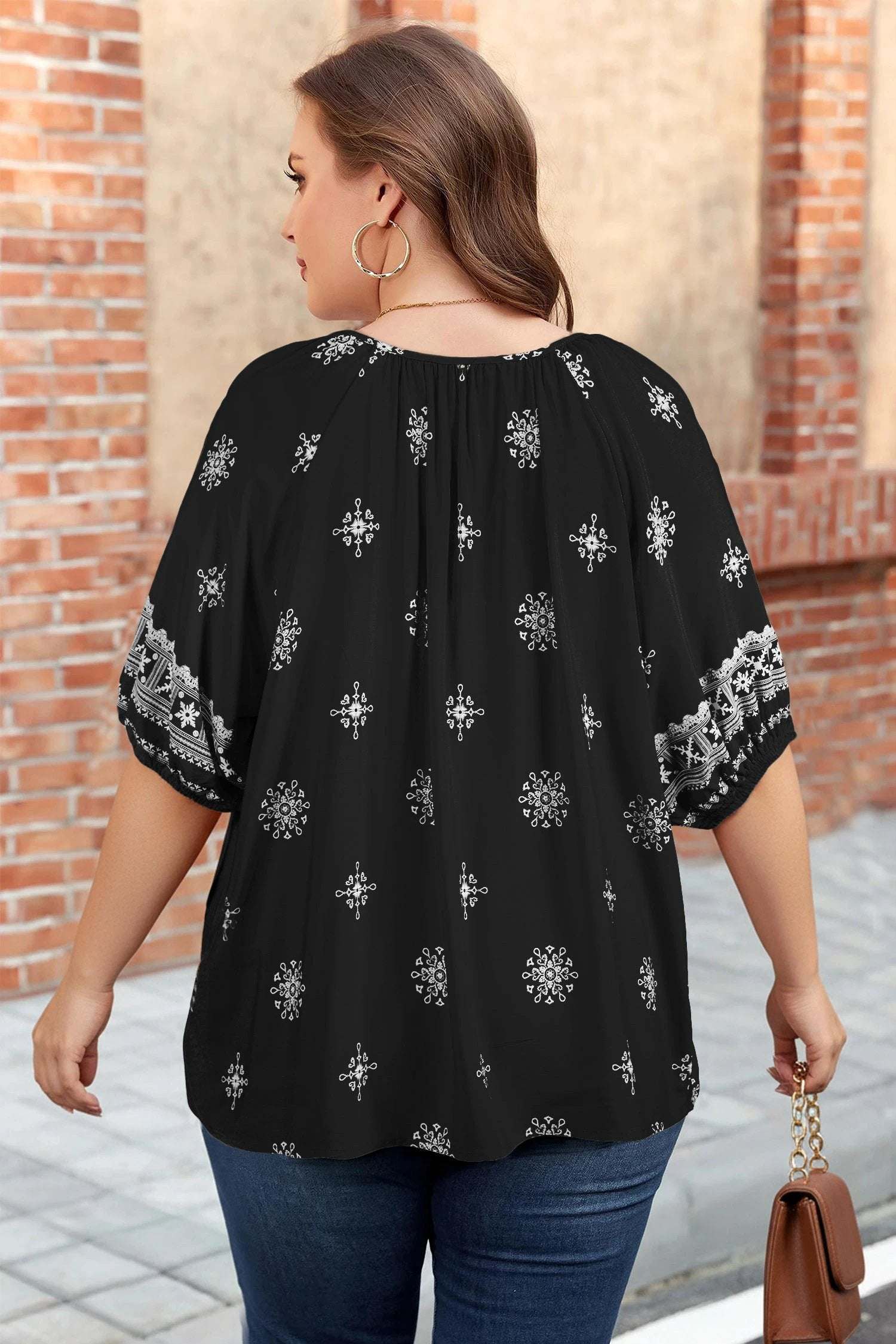 Plus size emerald green floral Effortless Boho blouse with notched V-neck and short sleeves