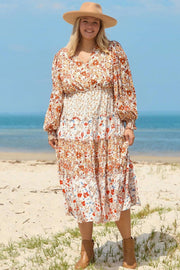 Plus size boho floral tiered ruffle maxi dress with long sleeves and flowing silhouette embodying main character energy