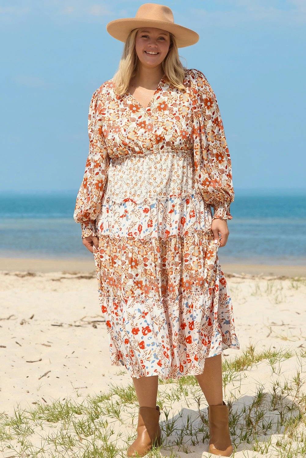 Plus size boho floral tiered ruffle maxi dress with long sleeves and flowing silhouette embodying main character energy