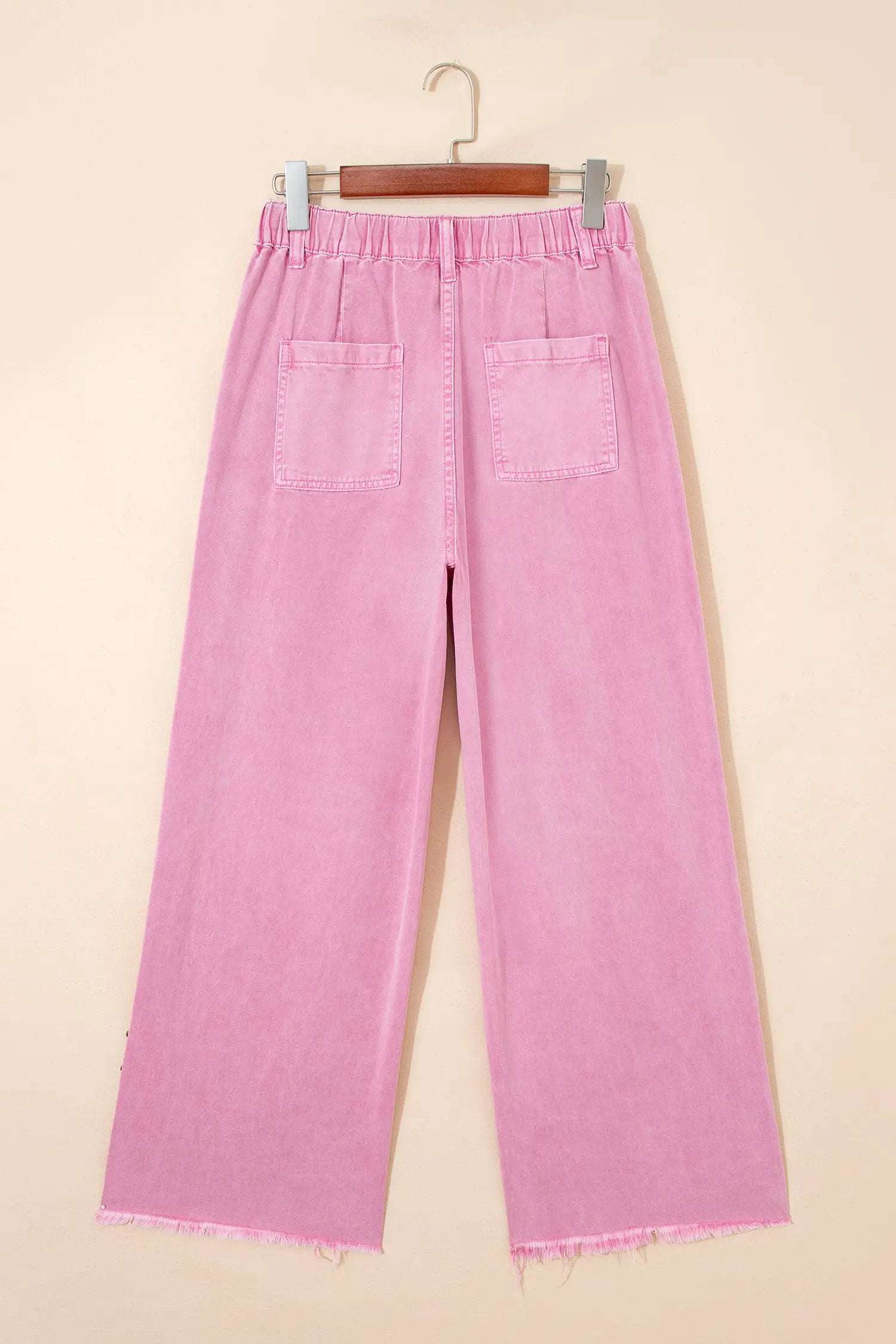Pink high rise wide-leg jeans with beaded side detail and split hem