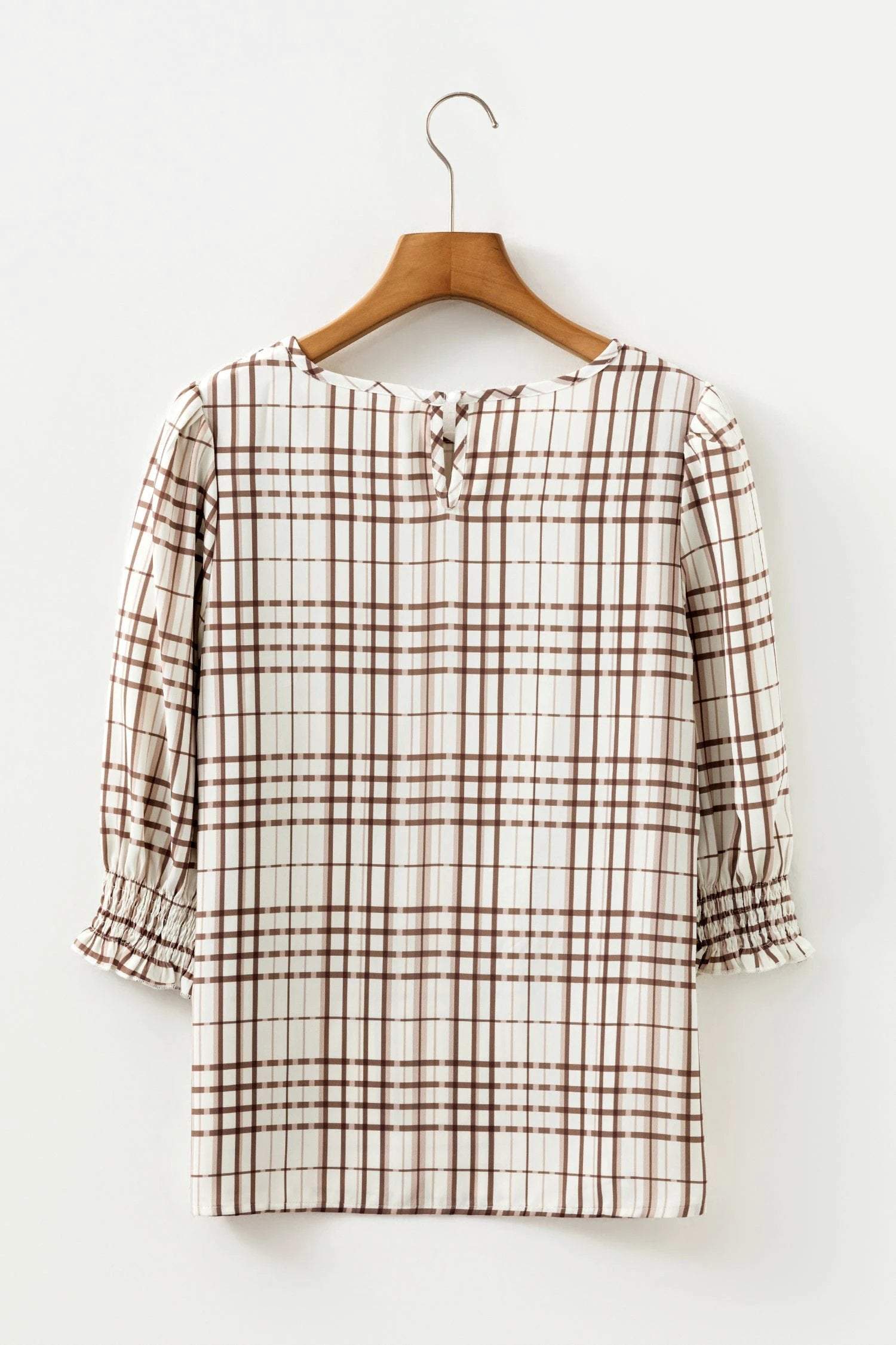 Woman wearing an effortless mom chic plaid frilled puffy half sleeve blouse