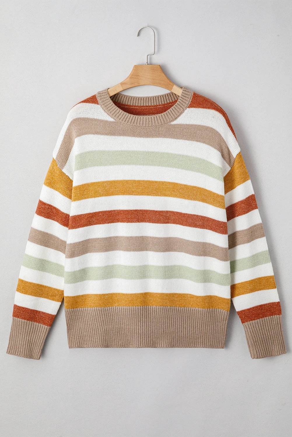 Plus size striped colorblock drop shoulder sweater in earthy tones on plus-size model