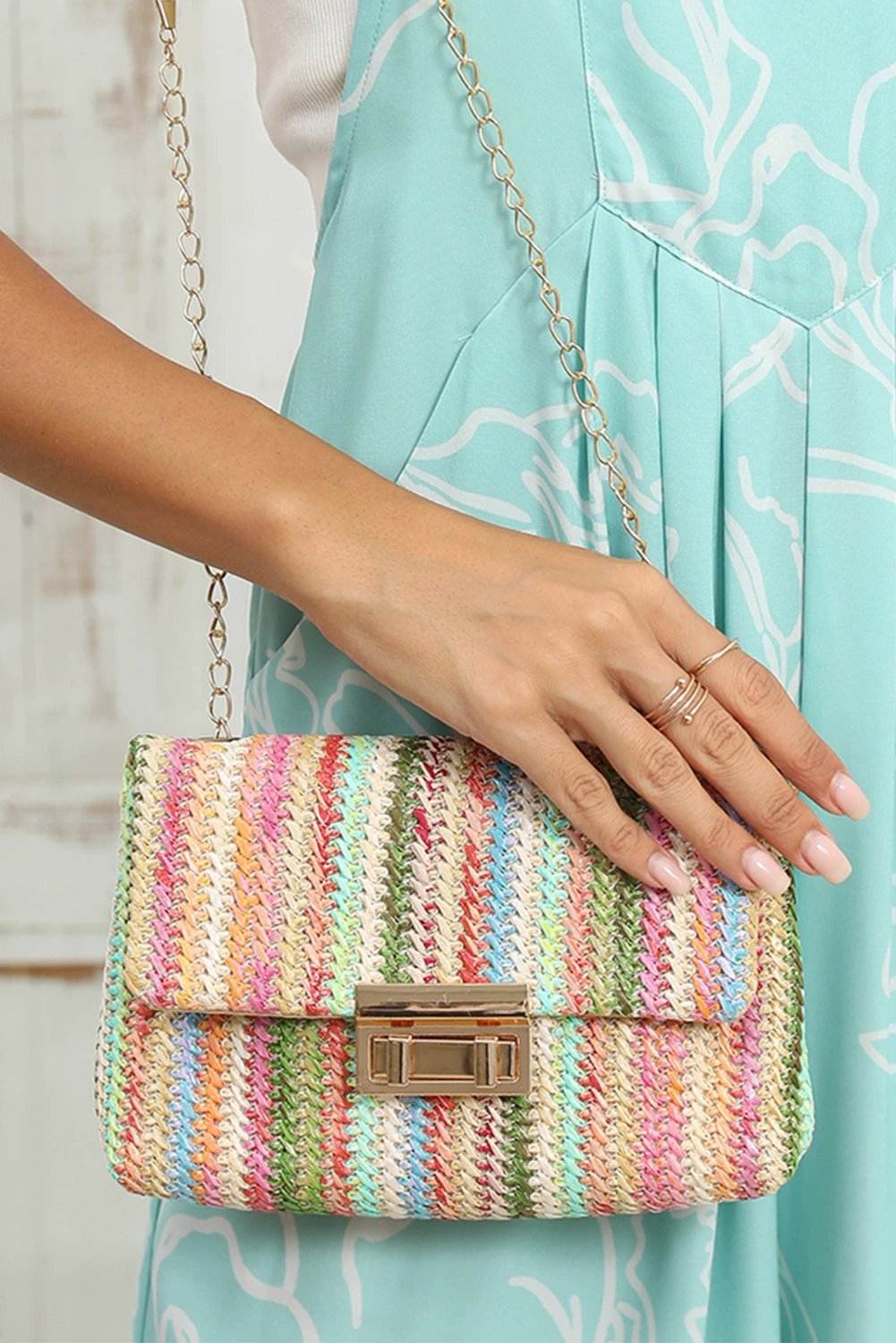 Straw pink bohemian woven shoulder bag with multicolor stripes and gold chain strap