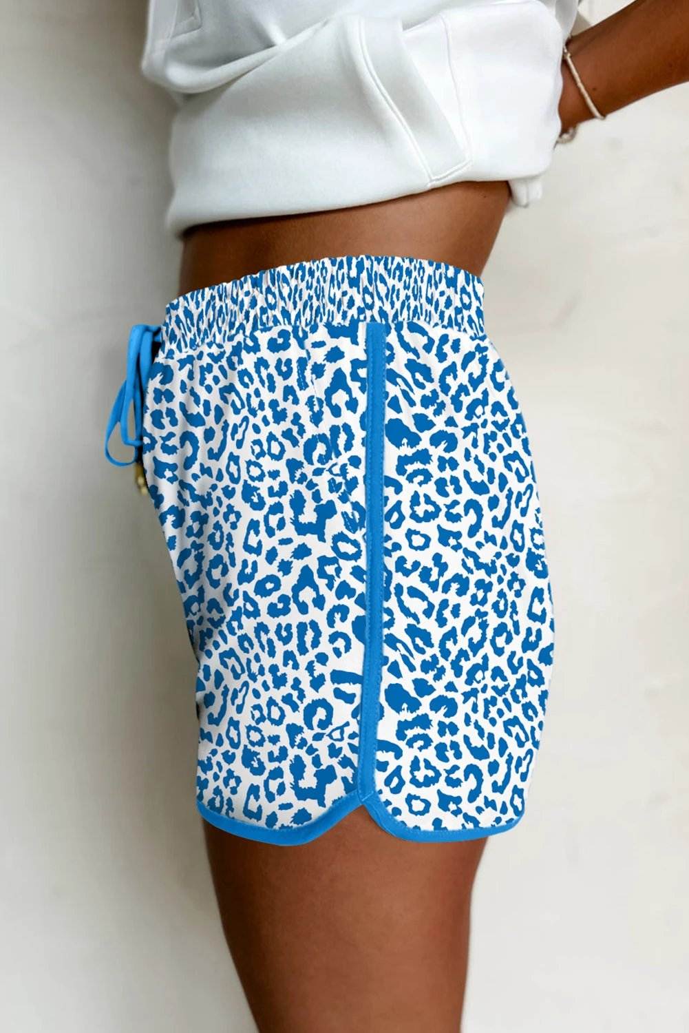 Leopard print elastic waistband shorts with lace-up trim and contrast edging for effortless mom style
