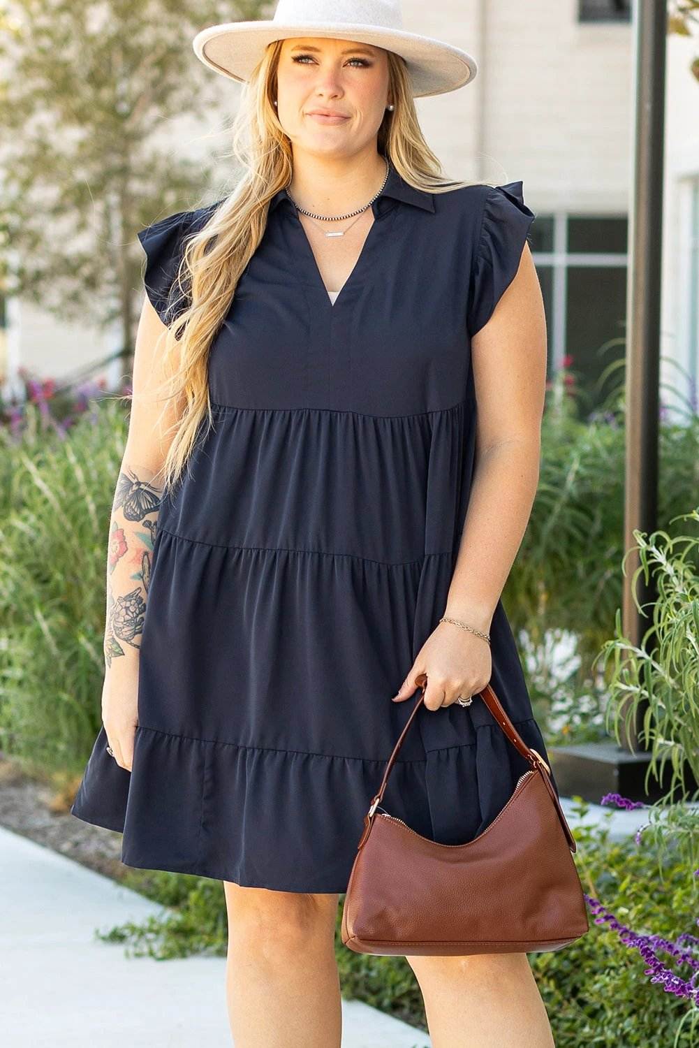 Plus size collared V-neck navy dress with flutter sleeves and tiered skirt