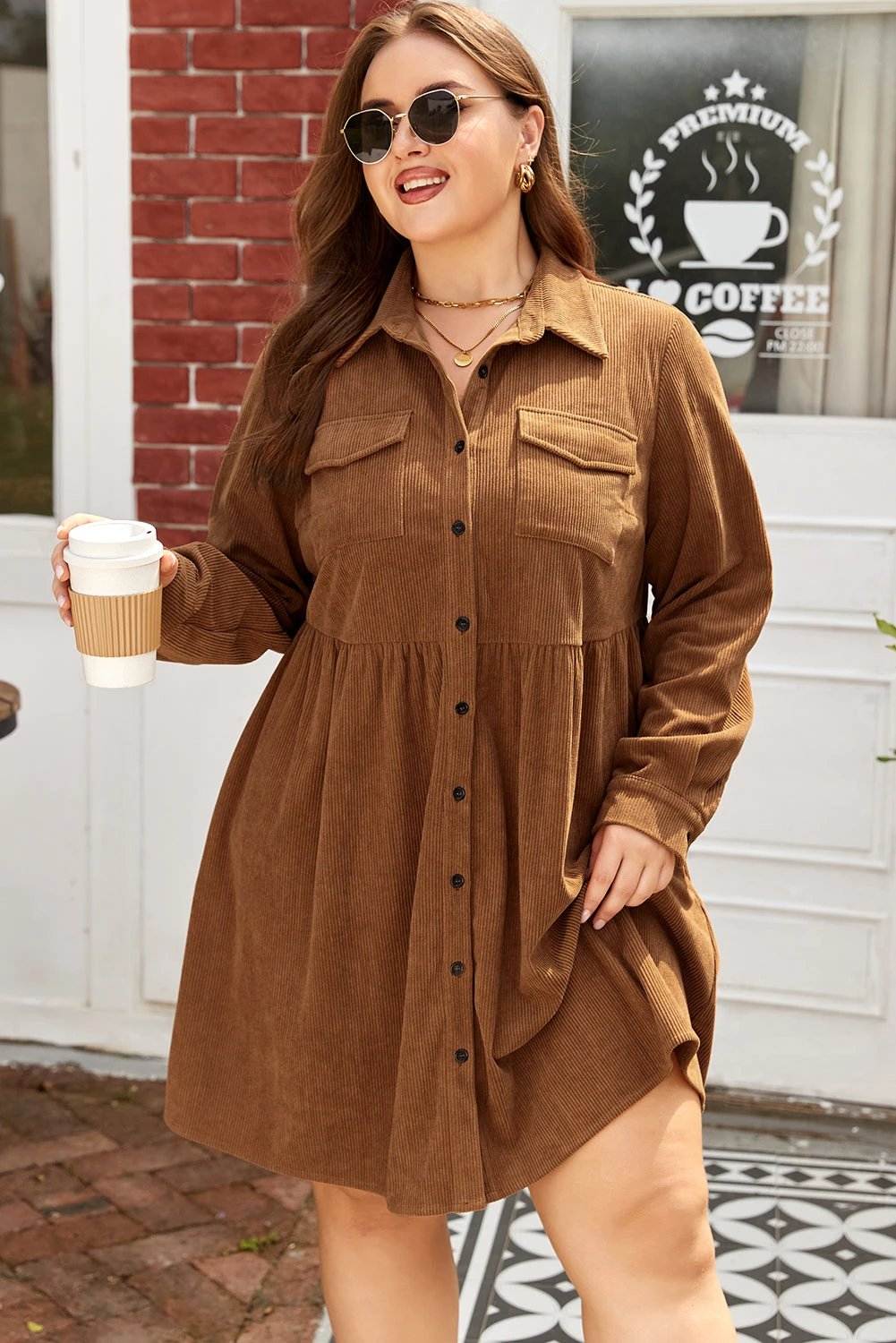 Plus size brown corduroy button-front shirt dress with collared neckline and A-line silhouette