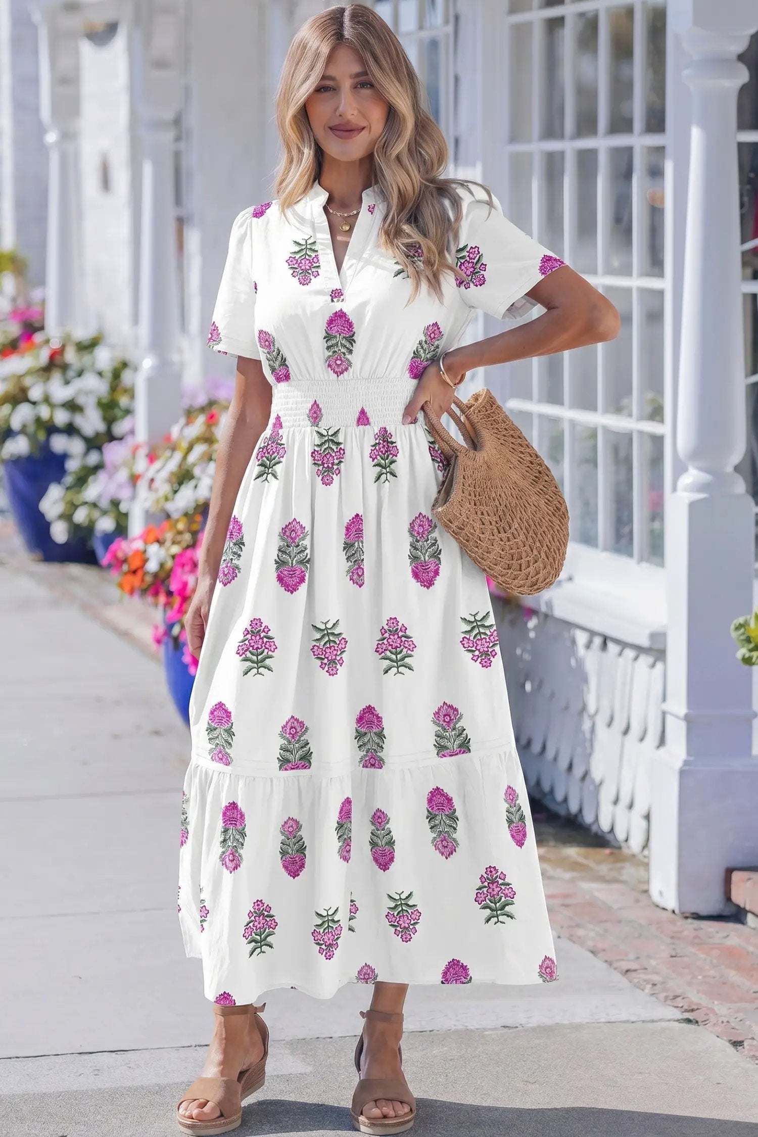 Woman wearing floral print split neck maxi dress with shirred waist and ruffle hem, main character energy style