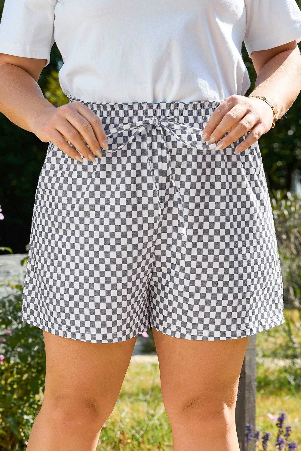 Plus size checkerboard lace-up high waist shorts with drawstring showcasing mom energy style