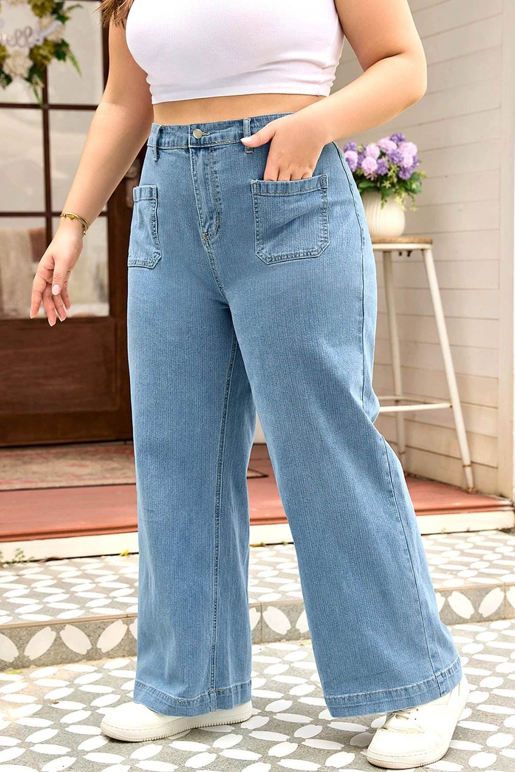 Plus size patch pocket textured wide leg jeans with mid-to-high rise and relaxed fit for stylish comfort