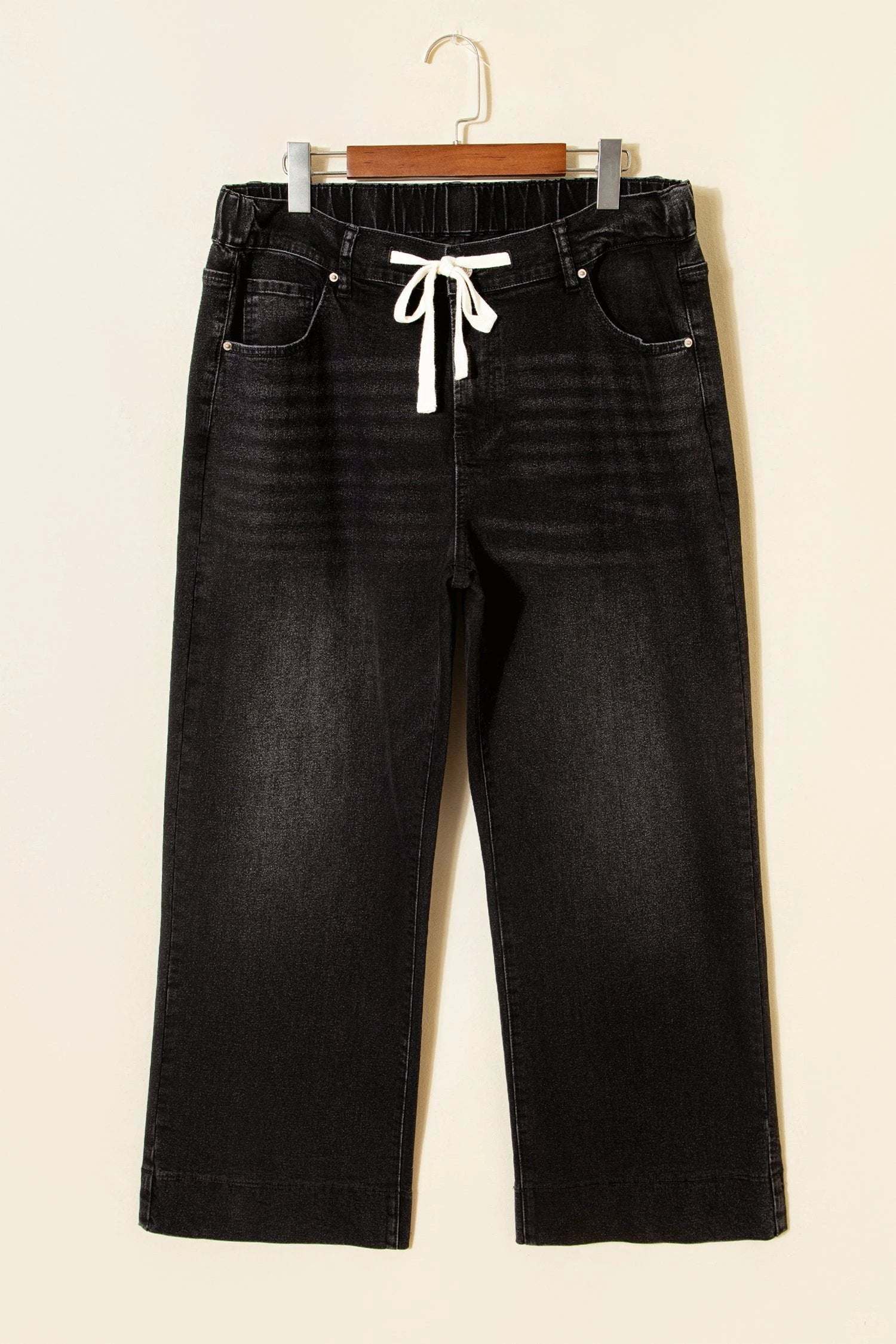 Plus size acid wash lace-up high rise wide leg jeans showcasing Main Character Energy style