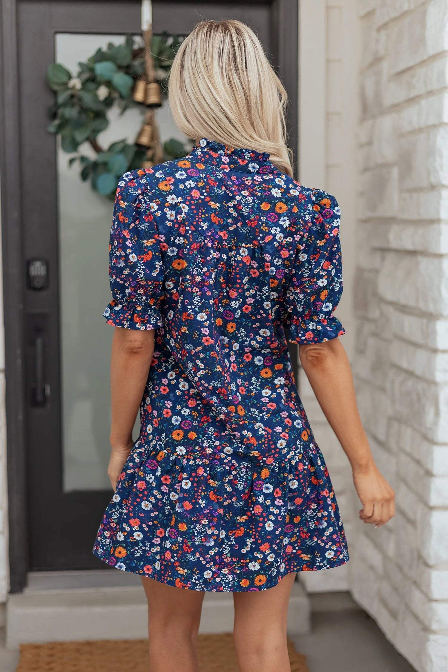 Navy mini dress with wild daisy floral print and puff sleeves